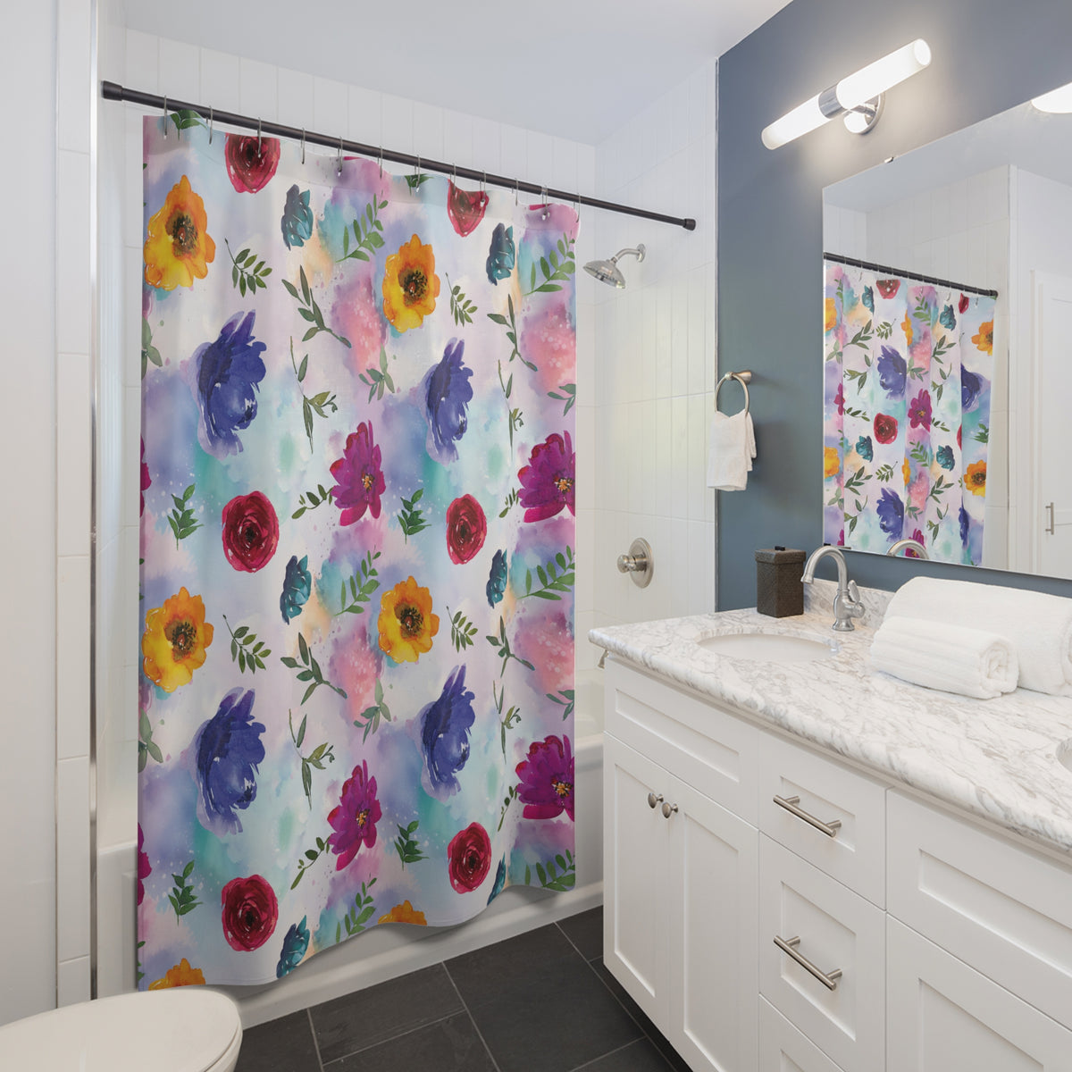 A bathroom with a colorful floral shower curtain, a white vanity with a marble countertop, and a mirror above the vanity.