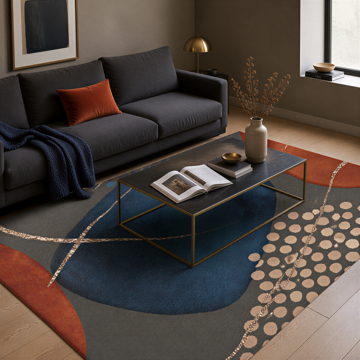 a modern living room with a gray sofa, a black coffee table, and a colorful abstract rug. The room has a minimalist and stylish design, with a few decorative elements such as a vase, a book, and a bowl.