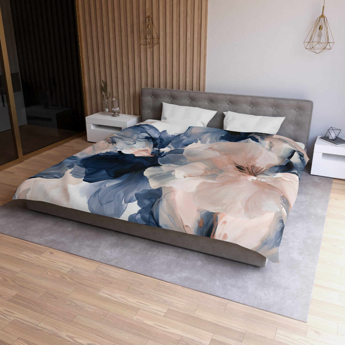 a bed with a floral comforter on top of it