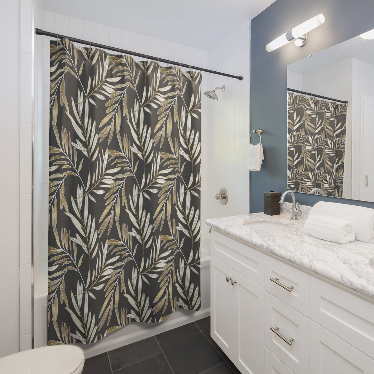 a modern bathroom with a white vanity, a shower curtain with a leafy pattern, and a mirror above the vanity.