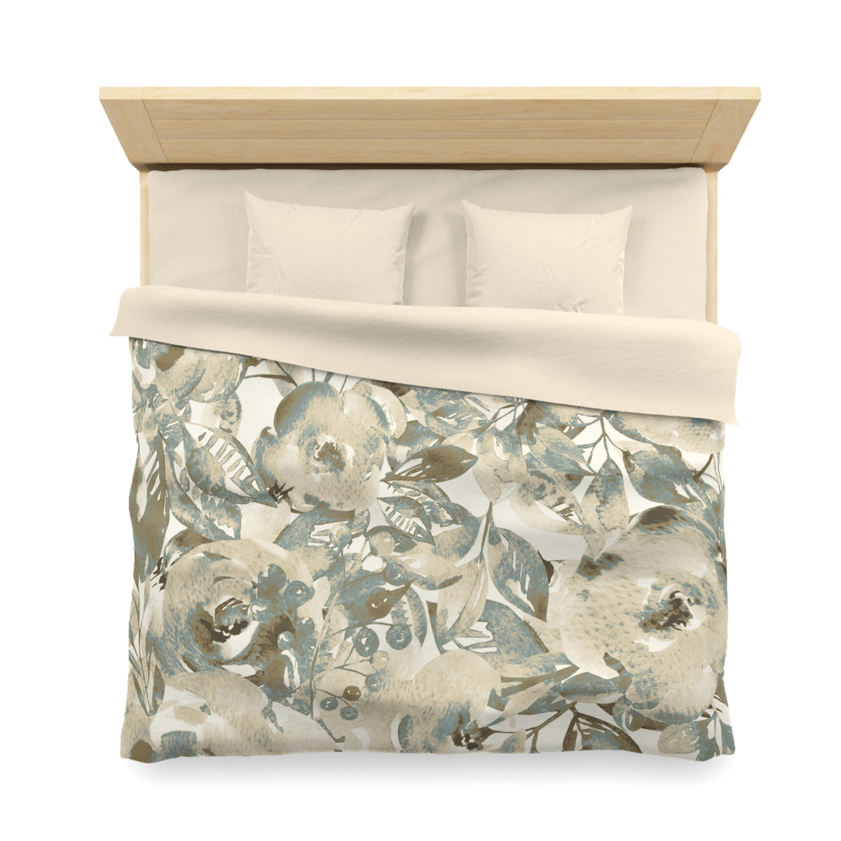 a neatly made bed with a floral print comforter and pillows.