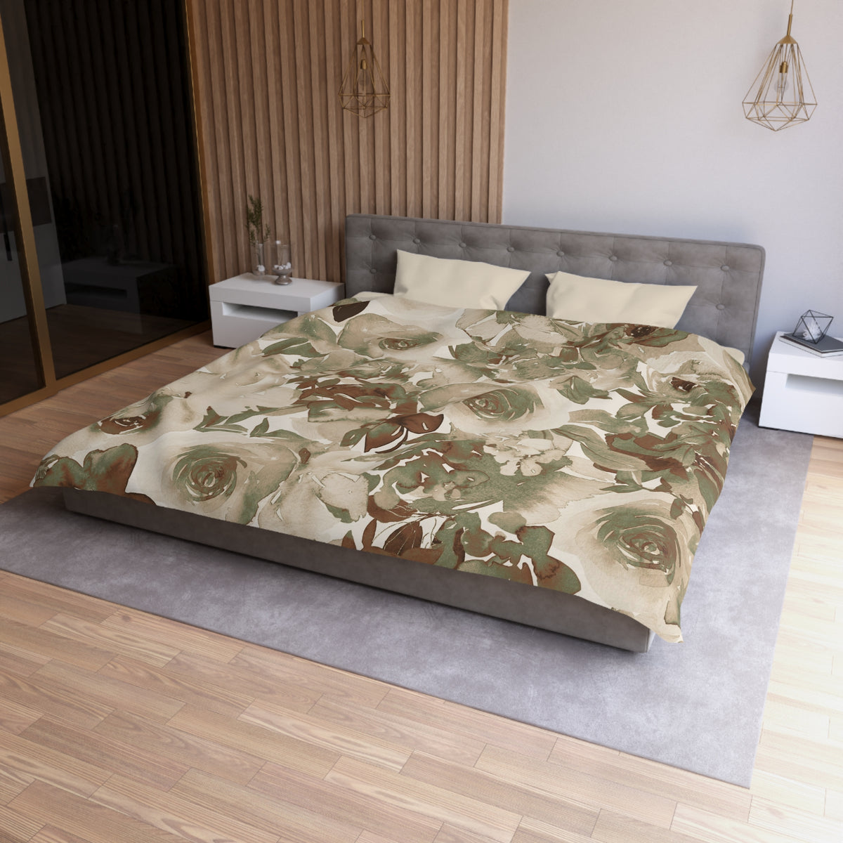 a modern bedroom with a large bed covered in a floral print comforter. The bed is positioned against a wall with a wooden panel. The room has a minimalist design, with a gray headboard and a white nightstand on each side of the bed. The floor is covered with a gray rug, and there is a pendant light hanging above the bed.