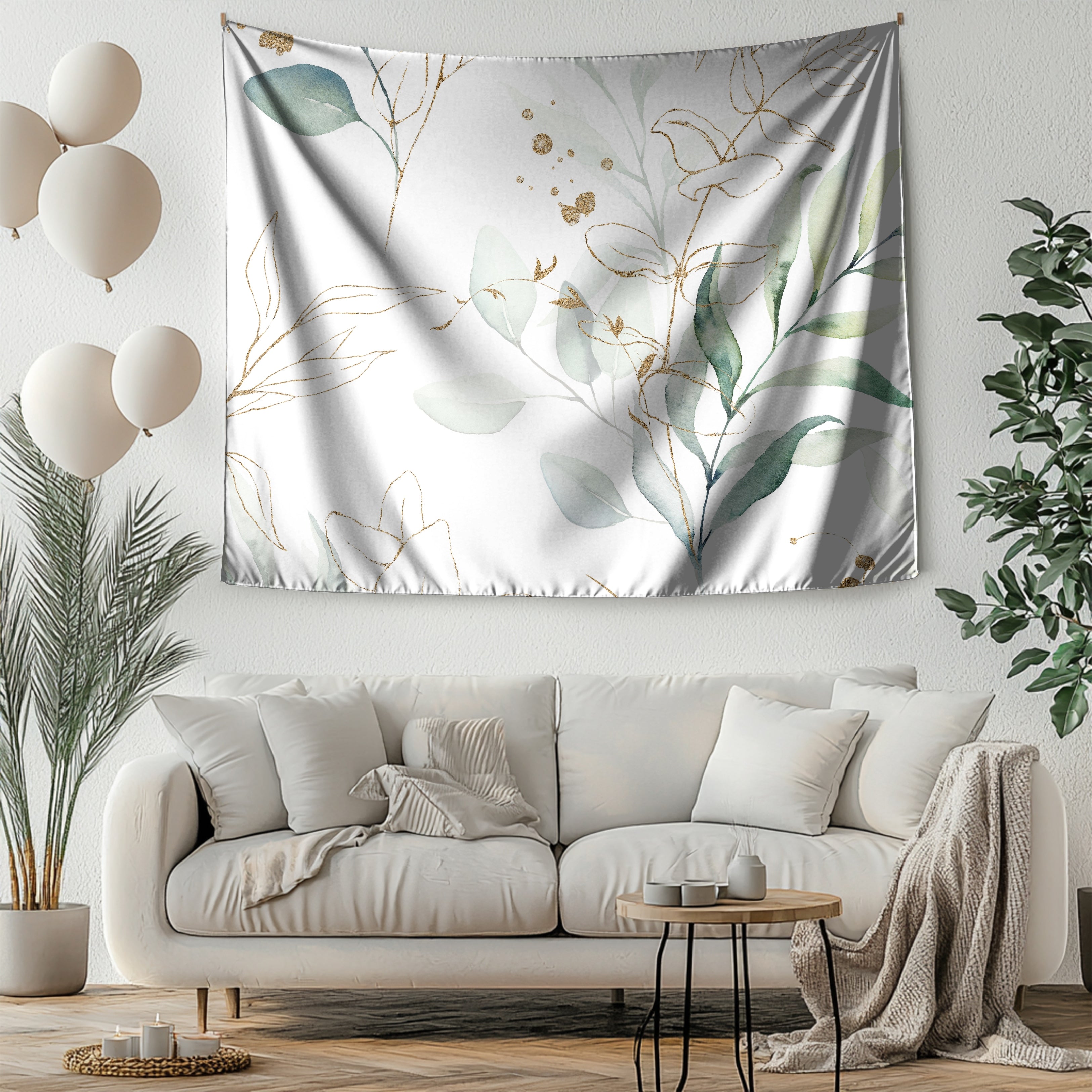 a living room with a white sofa, a coffee table, and a large tapestry hanging on the wall above the sofa.