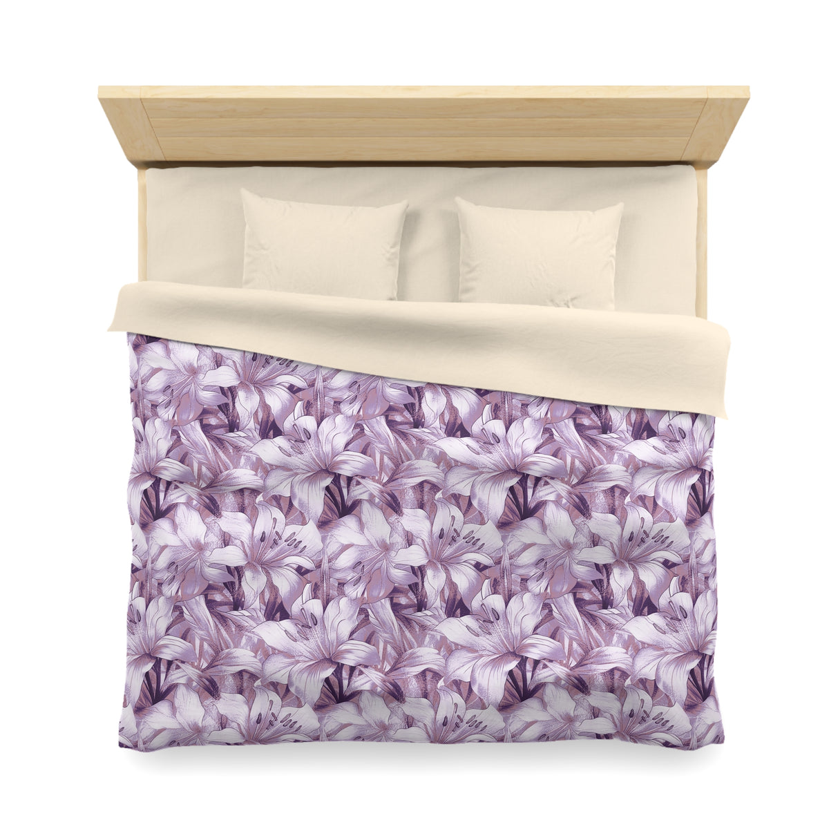 a neatly made bed with a floral patterned comforter and pillows.