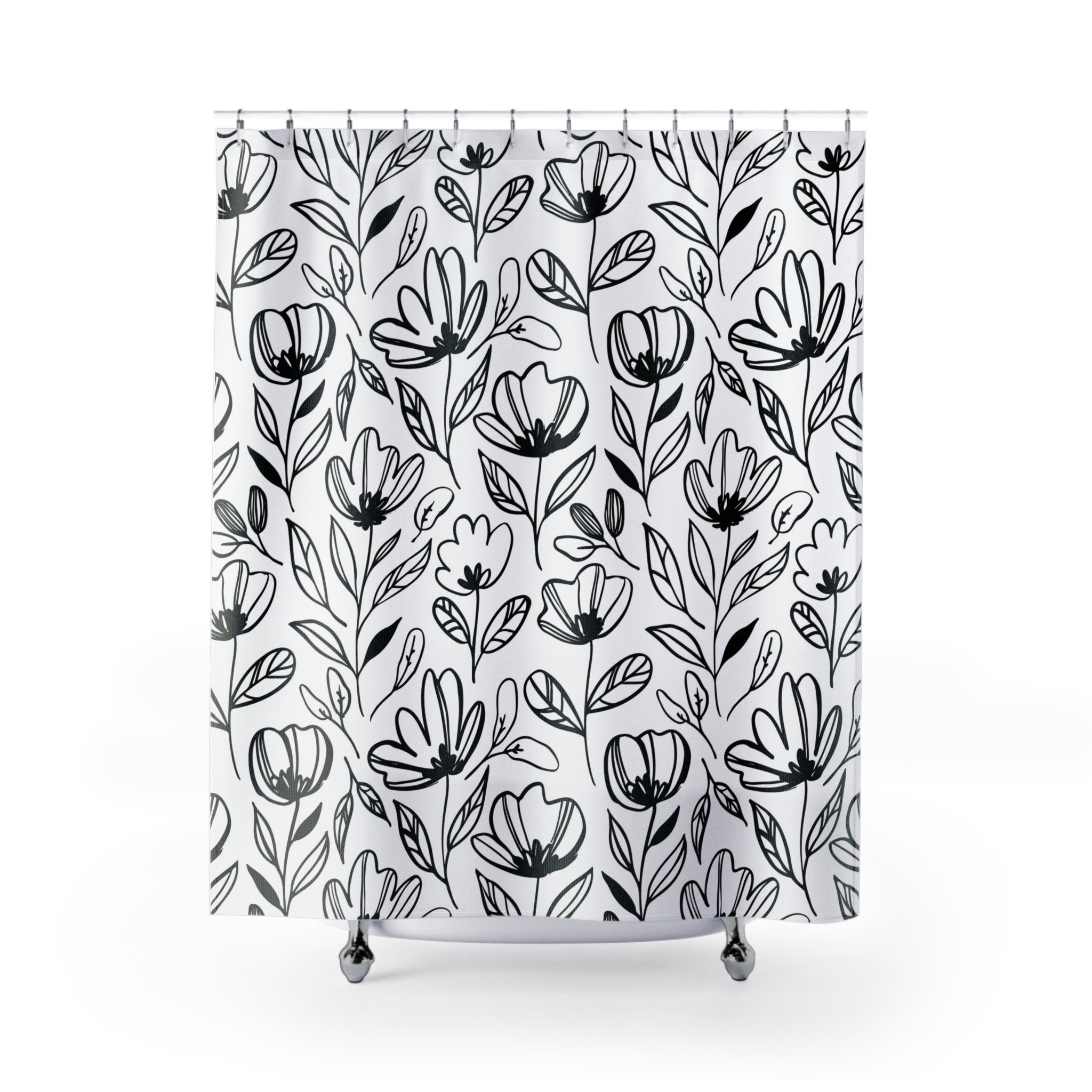 a white shower curtain with black and white flowers