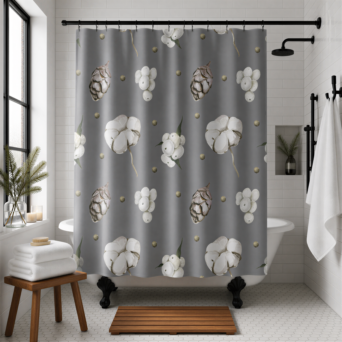 a bathroom with a gray shower curtain adorned with white flowers and pine cones. The shower curtain is hanging from a rod, and the bathroom has a white bathtub, a wooden stool, and a potted plant.