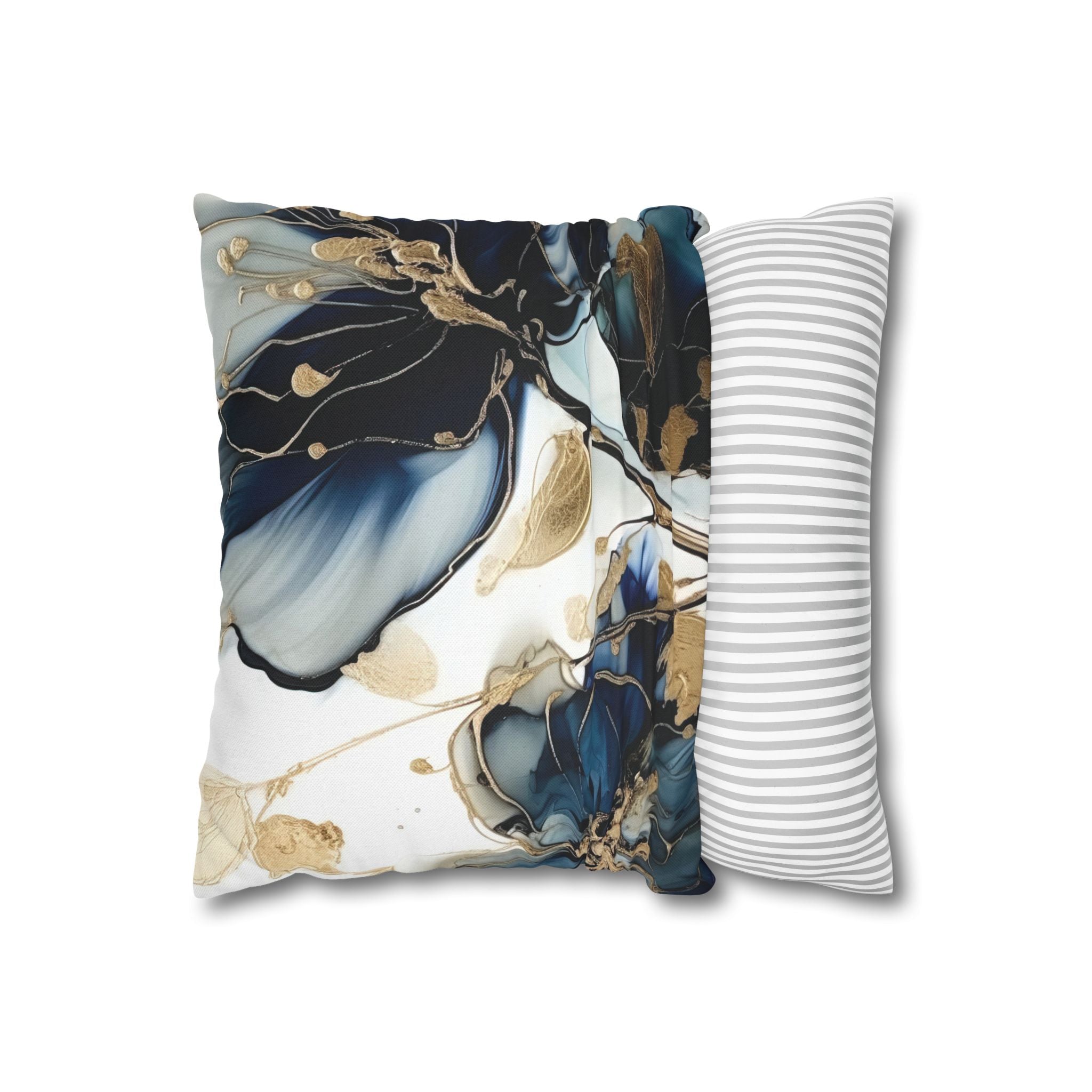 a decorative pillow with a floral pattern in shades of blue and gold.