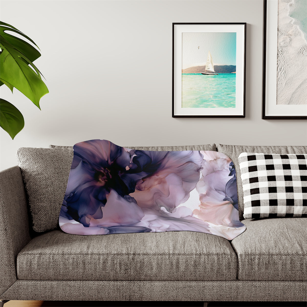 a living room with a couch and pictures on the wall