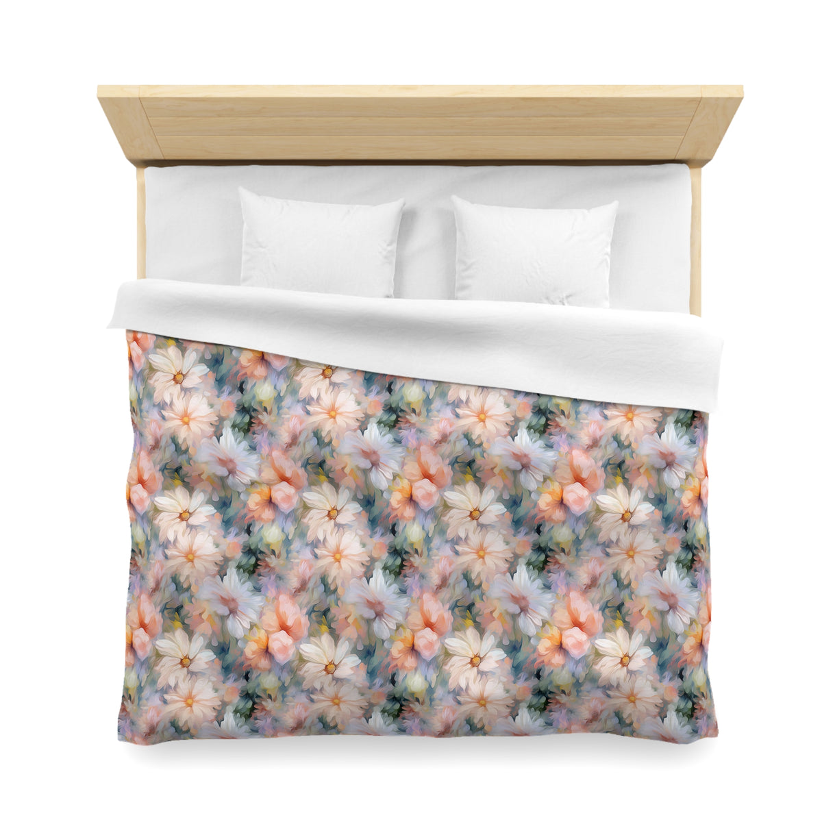a bed with a floral print comforter and pillows.