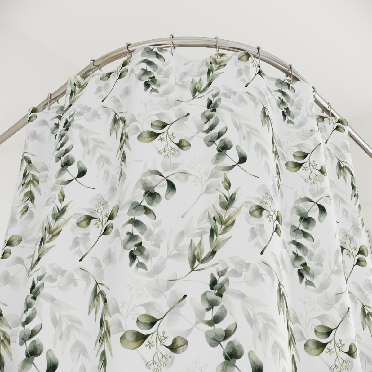 a shower curtain with a repeating pattern of green leaves and branches, creating a natural and calming visual effect.