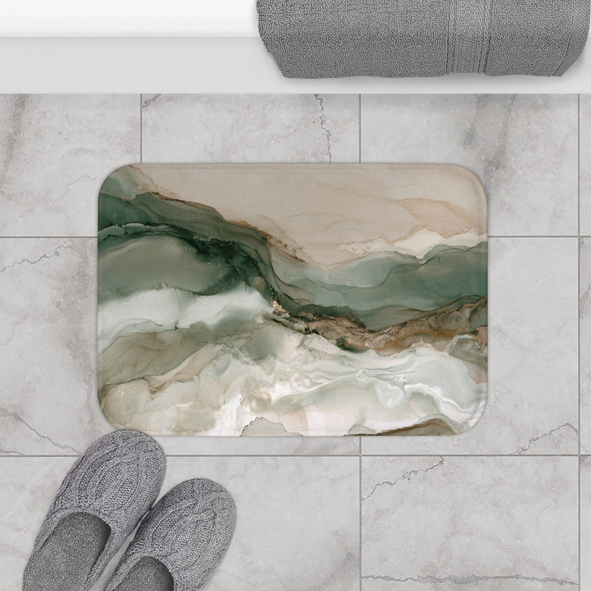 a bathroom floor with a marble-like tile pattern, a pair of gray slippers, and a rolled-up gray towel.