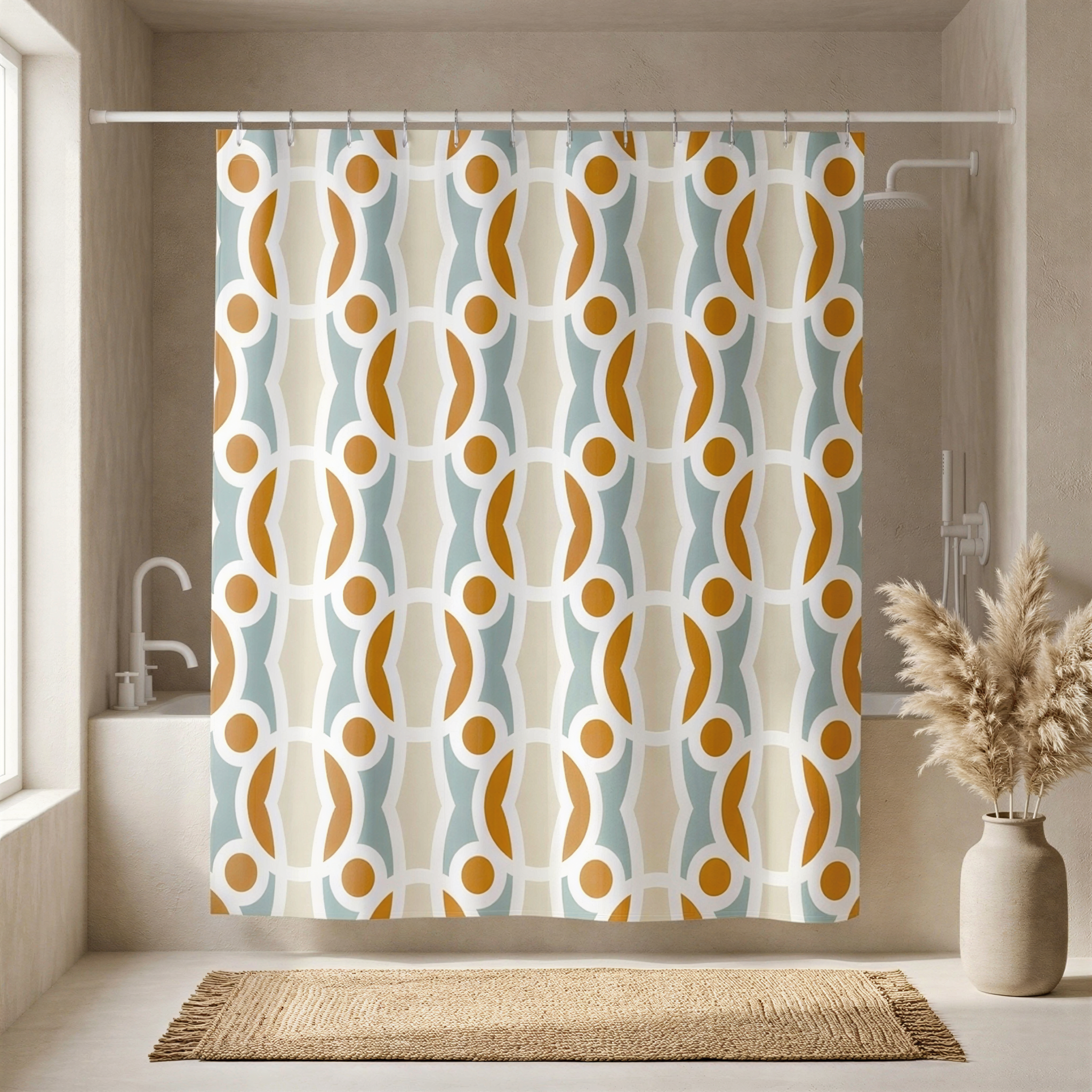 a bathroom with a shower curtain featuring a repeating pattern of circles and lines in shades of orange, blue, and white. The curtain is hanging from a rod, and there is a vase with dried flowers placed on a rug in front of the shower area.