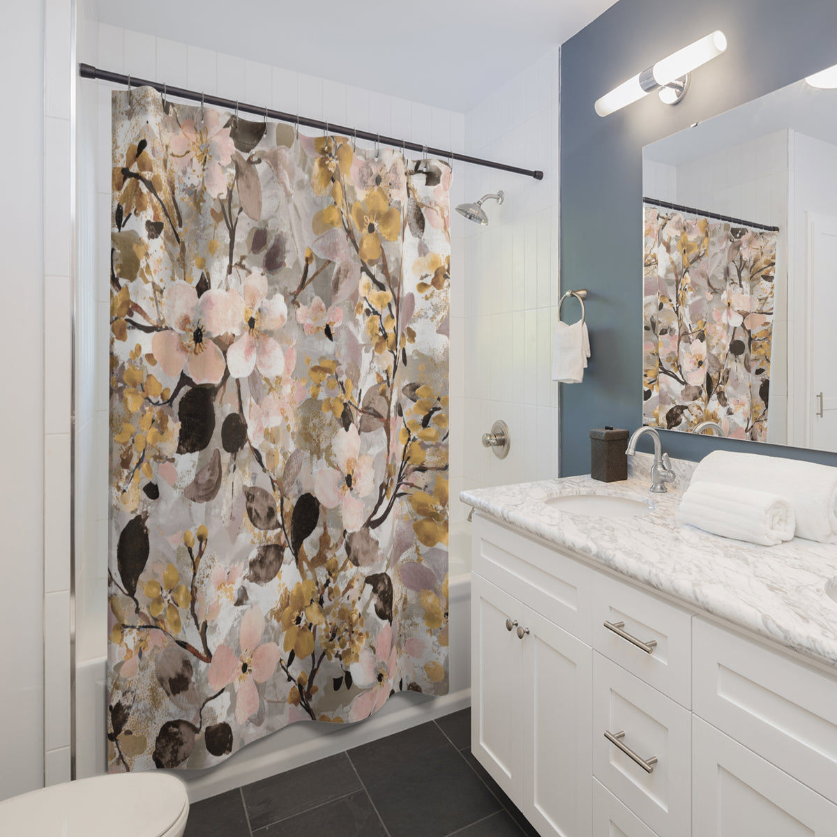 a modern bathroom with a white vanity, a shower curtain with a floral print, and a mirror above the vanity.