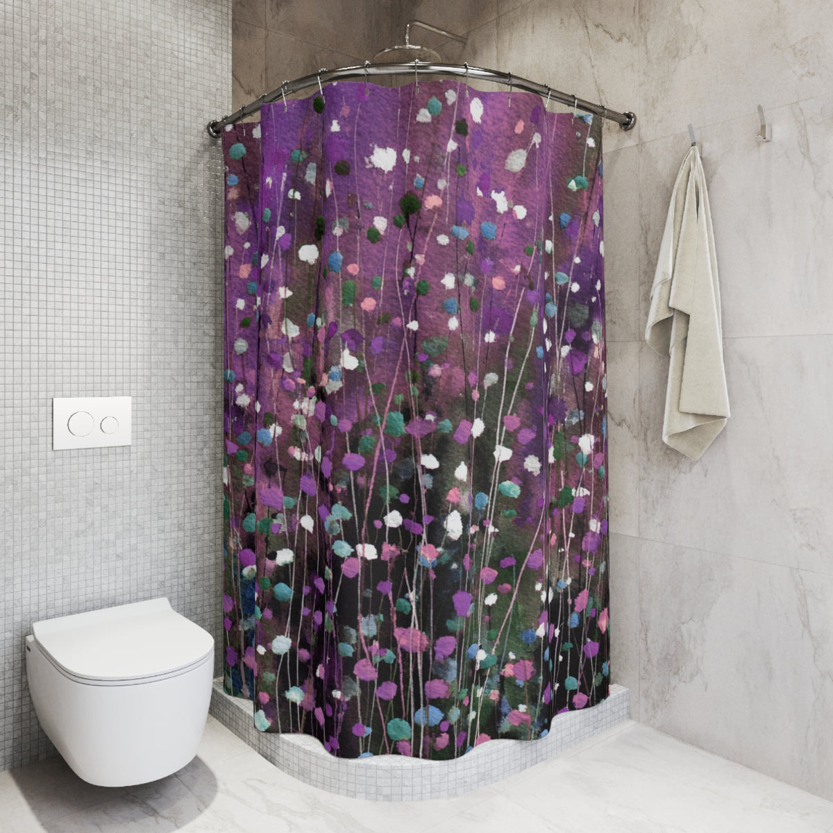 a bathroom with a shower curtain that has a colorful, abstract floral pattern in shades of purple and green. The shower curtain is hanging from a rod next to a white towel. The bathroom also includes a toilet and a tiled wall.