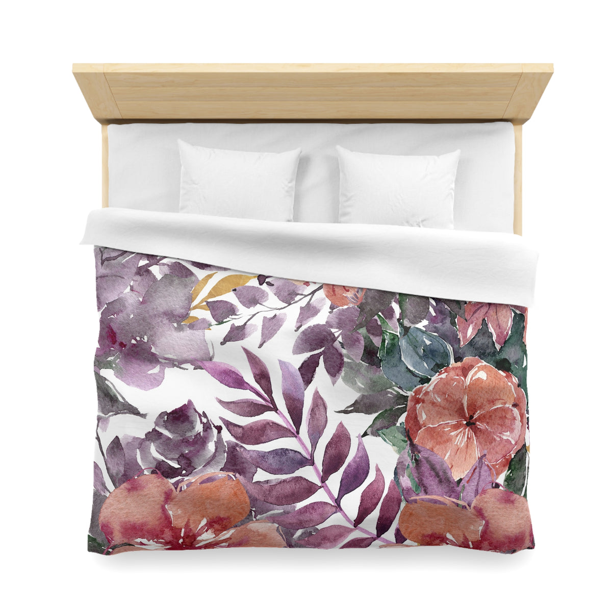 a bed with a floral print duvet cover featuring a variety of colorful flowers and leaves.