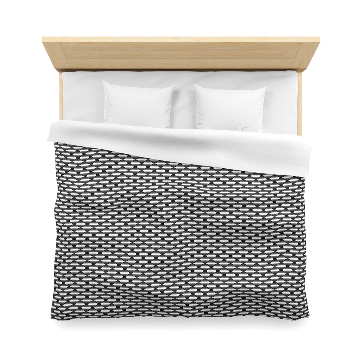 A neatly made bed with a black and white patterned comforter and two white pillows.