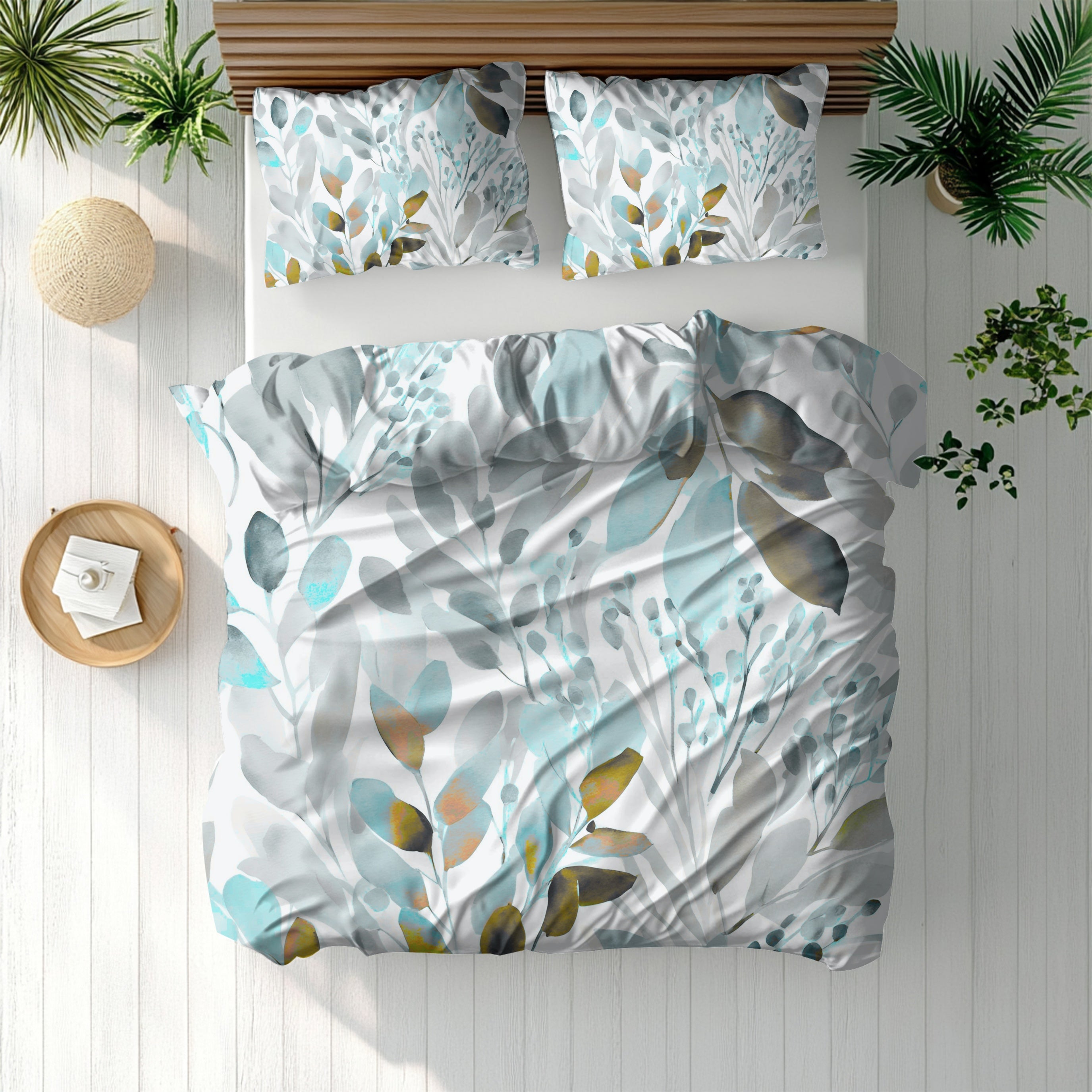 a bed with a white and blue floral print duvet cover and matching pillows, along with a wooden headboard. The bed is set against a backdrop of potted plants and a wooden floor, creating a cozy and natural atmosphere.