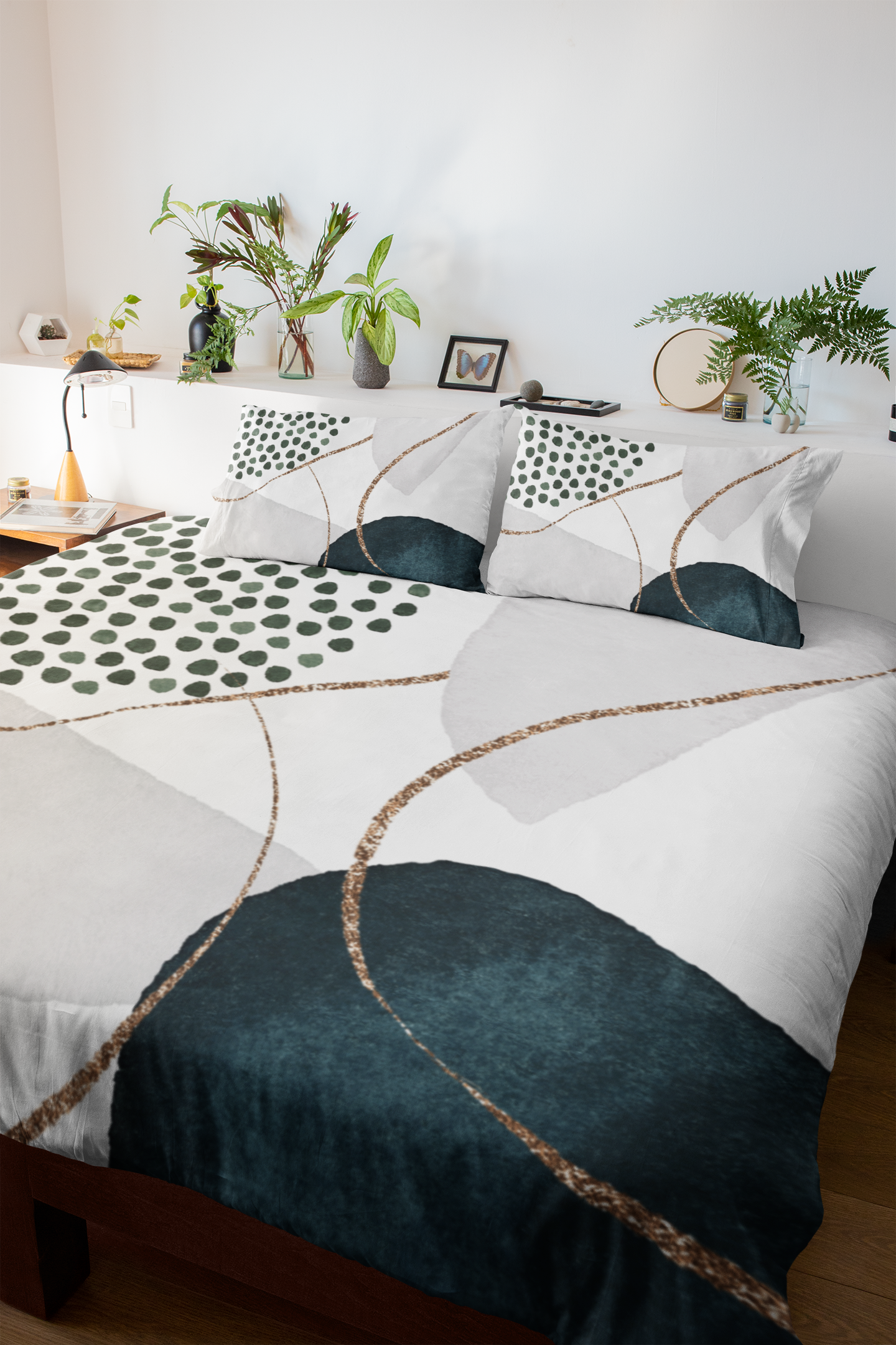 a bed with green and white sheets and pillows