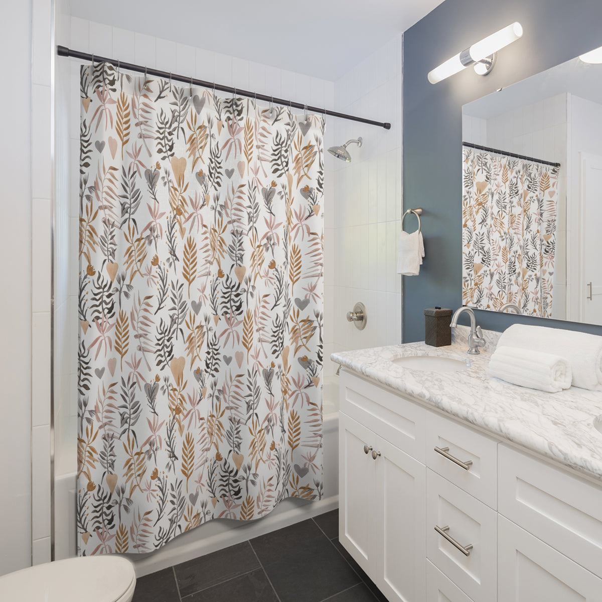a modern bathroom with a white vanity, a shower curtain with a floral pattern, and a mirror above the vanity.