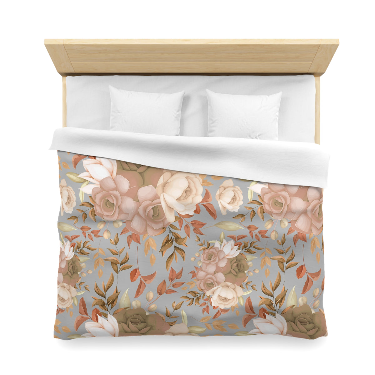a bed with a floral print duvet cover and pillows.