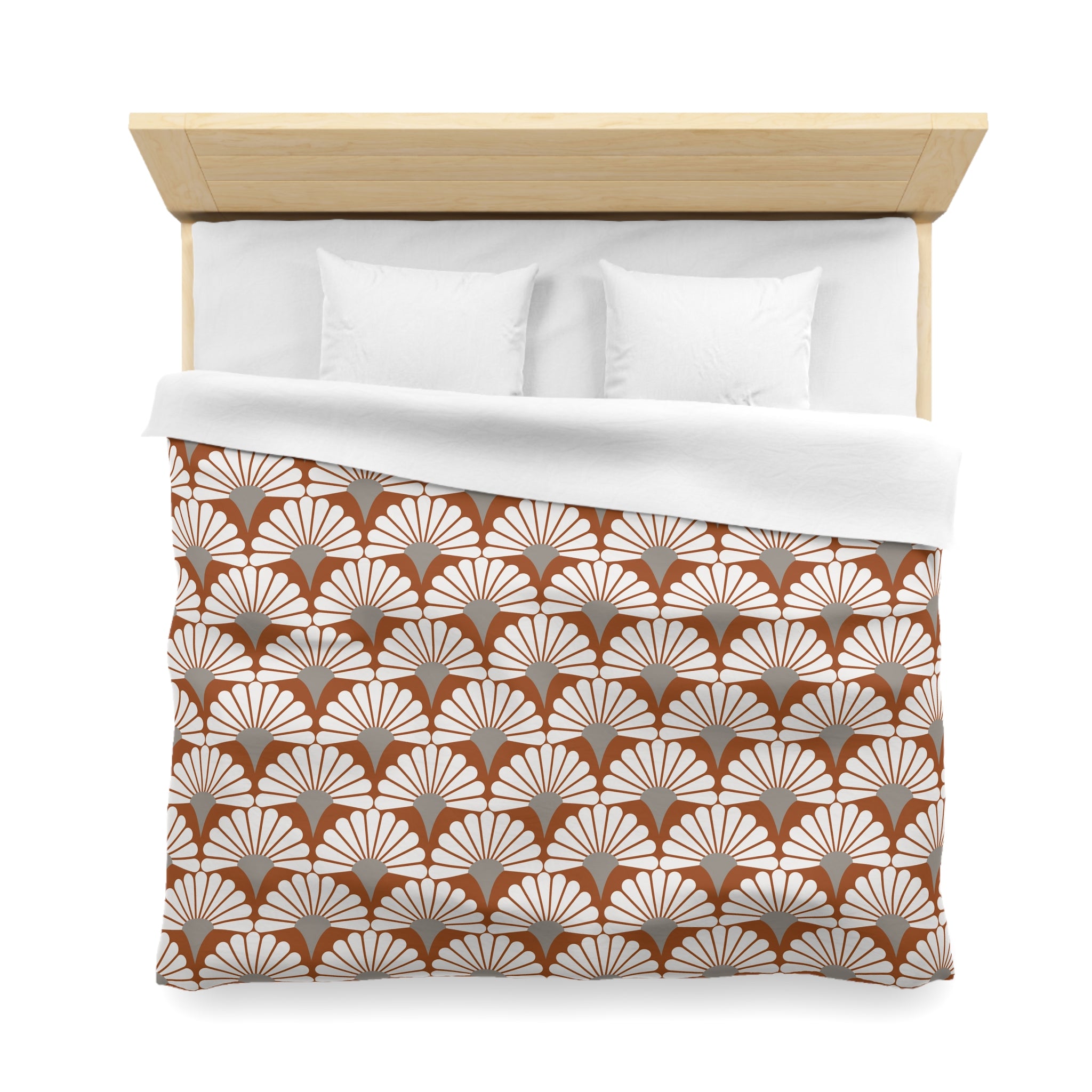 a neatly made bed with a wooden headboard and a white comforter featuring a repeating pattern of brown and white shells.