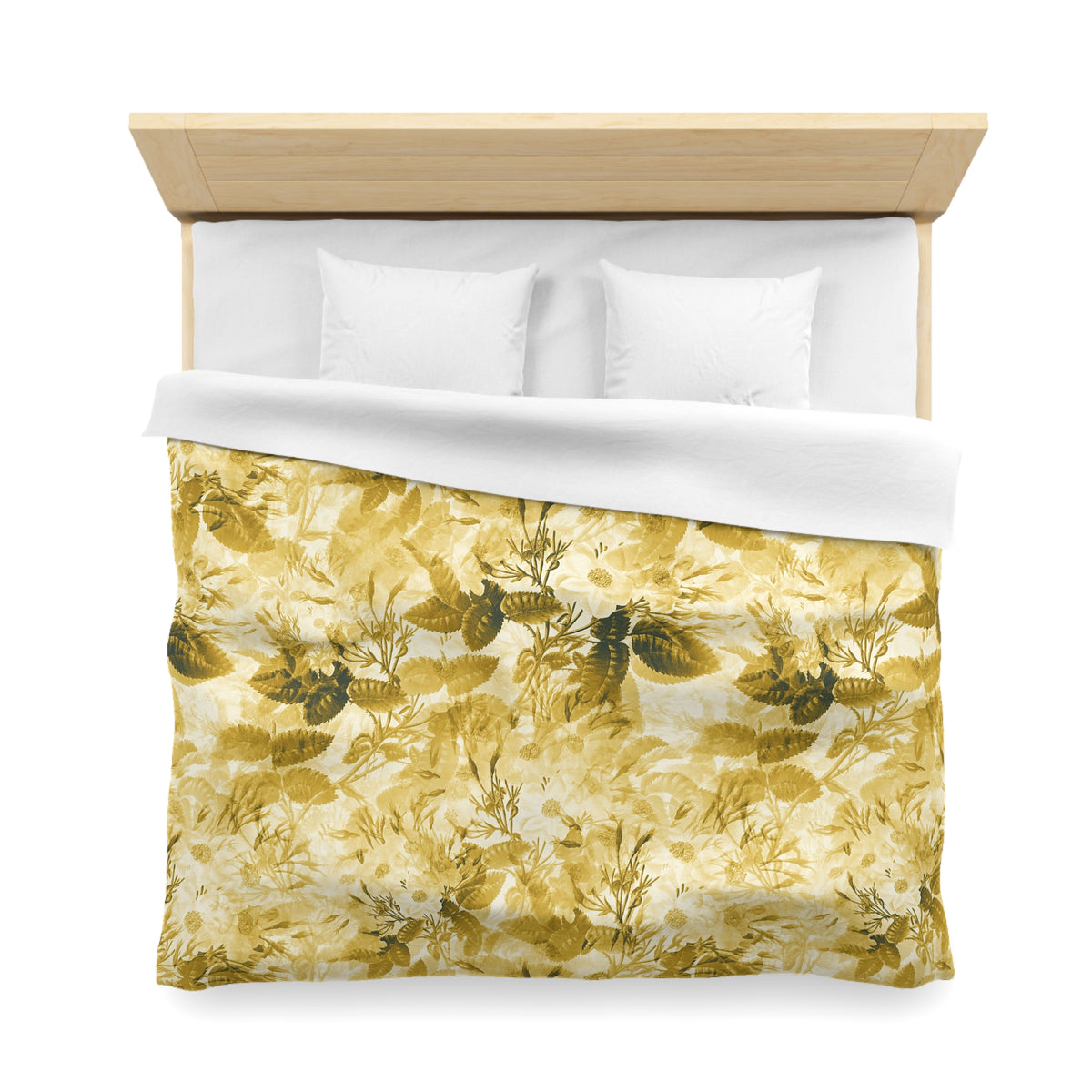 a neatly made bed with a yellow and green floral patterned comforter and pillows.
