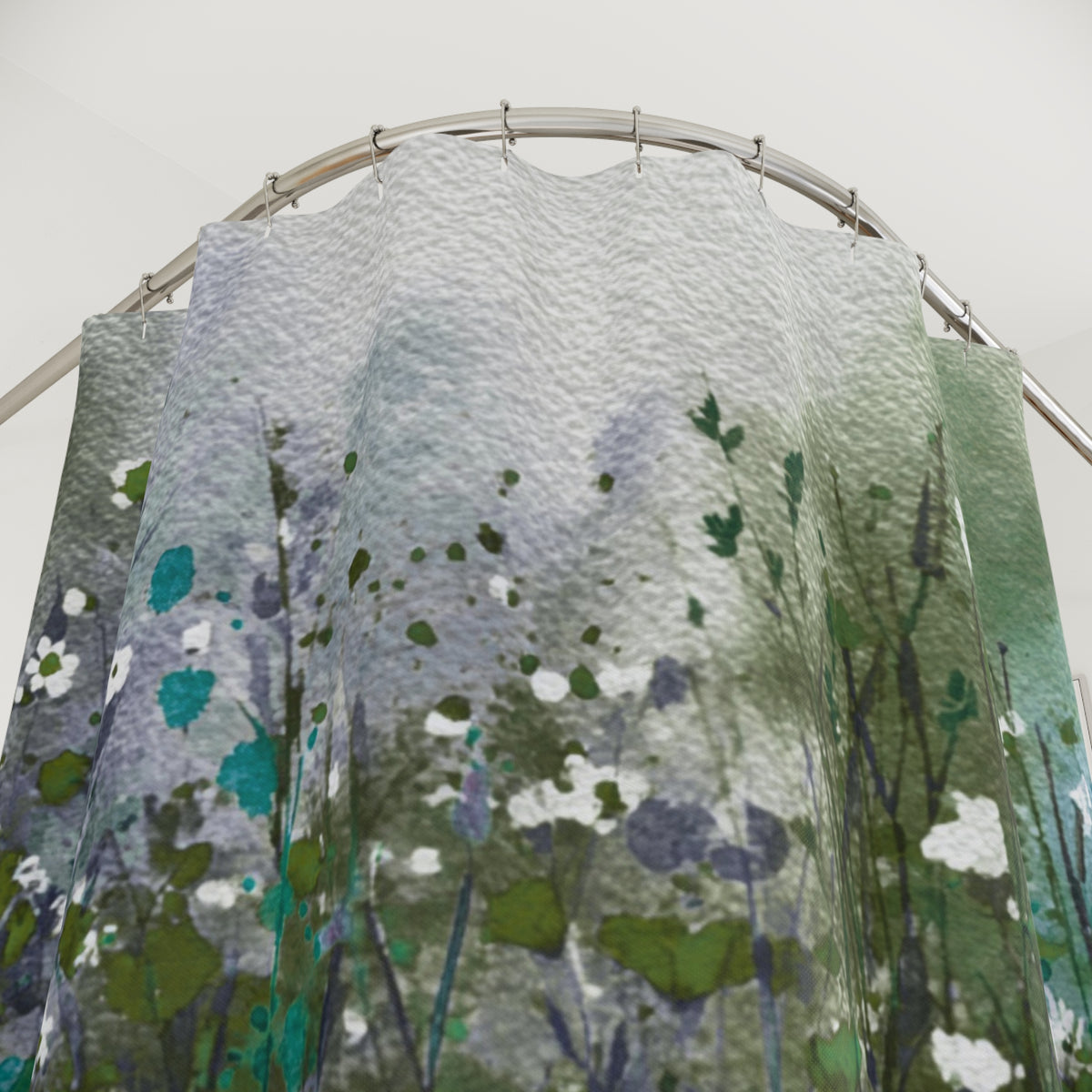 a shower curtain with a floral pattern, including green and white flowers and leaves.