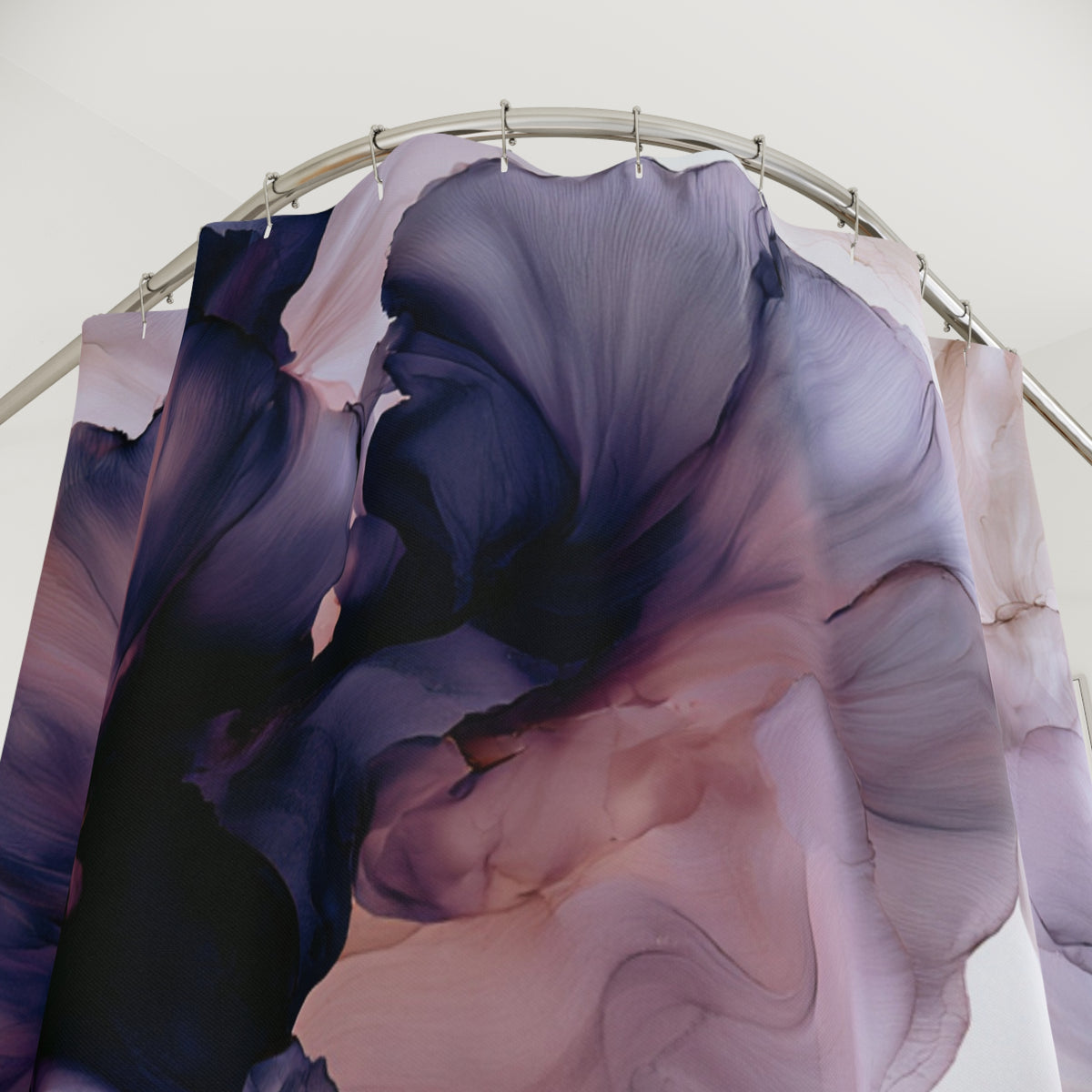 a shower curtain with a purple and black design on it