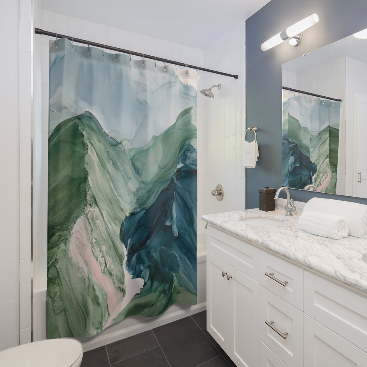 a modern bathroom with a large green and blue abstract painting hanging on the wall above the bathtub. The bathroom has white cabinets, a marble countertop, and a large mirror.