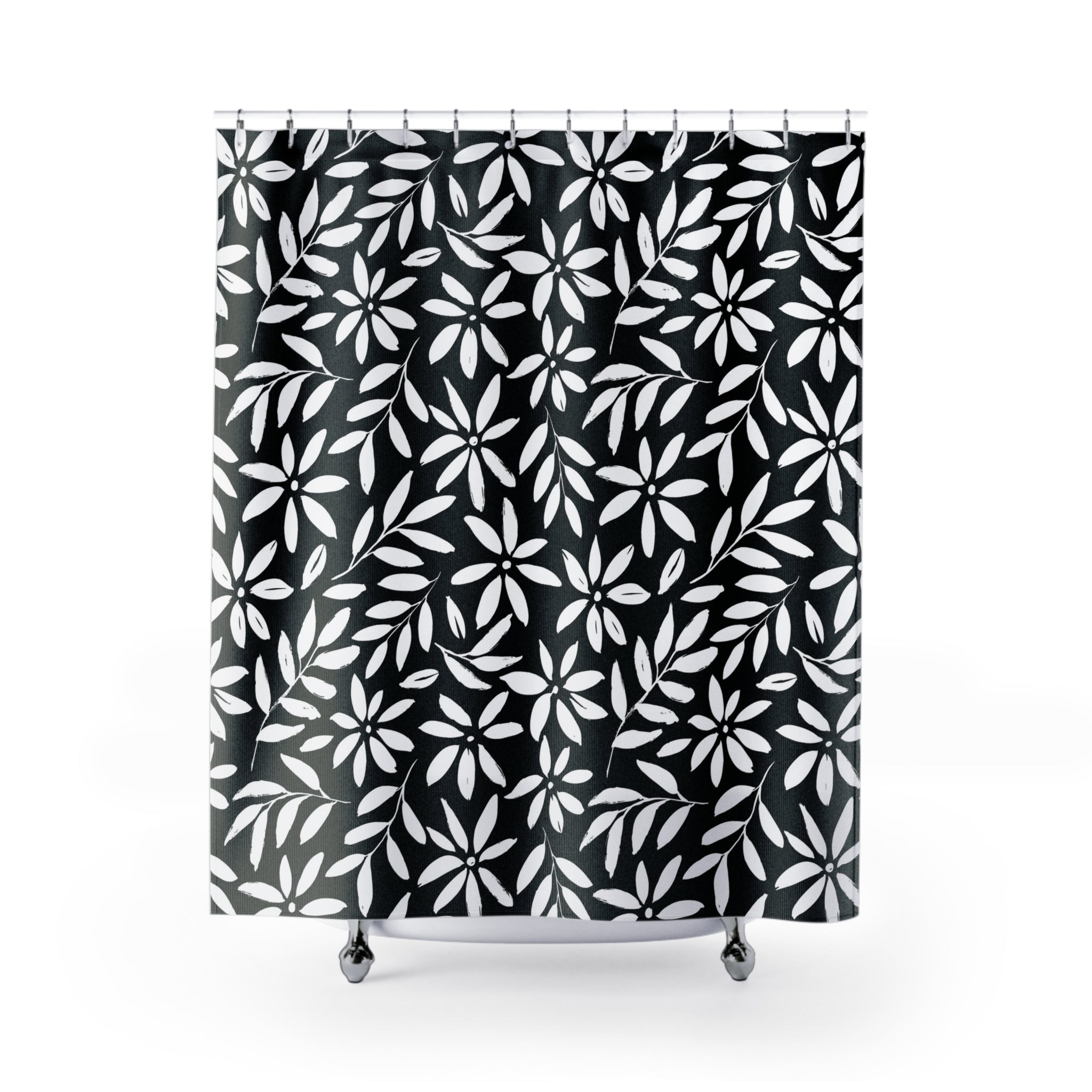 a shower curtain with a black and white pattern