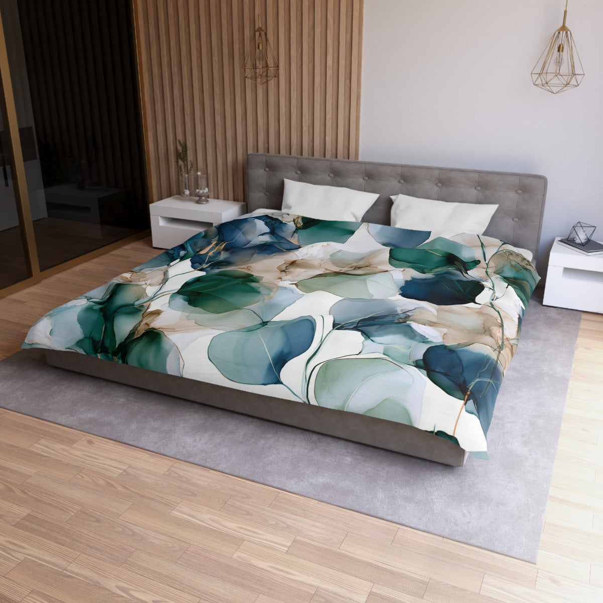 a bed with a floral comforter on top of it