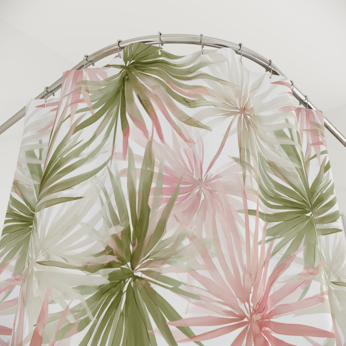 a shower curtain with a tropical leaf pattern in shades of green and pink.