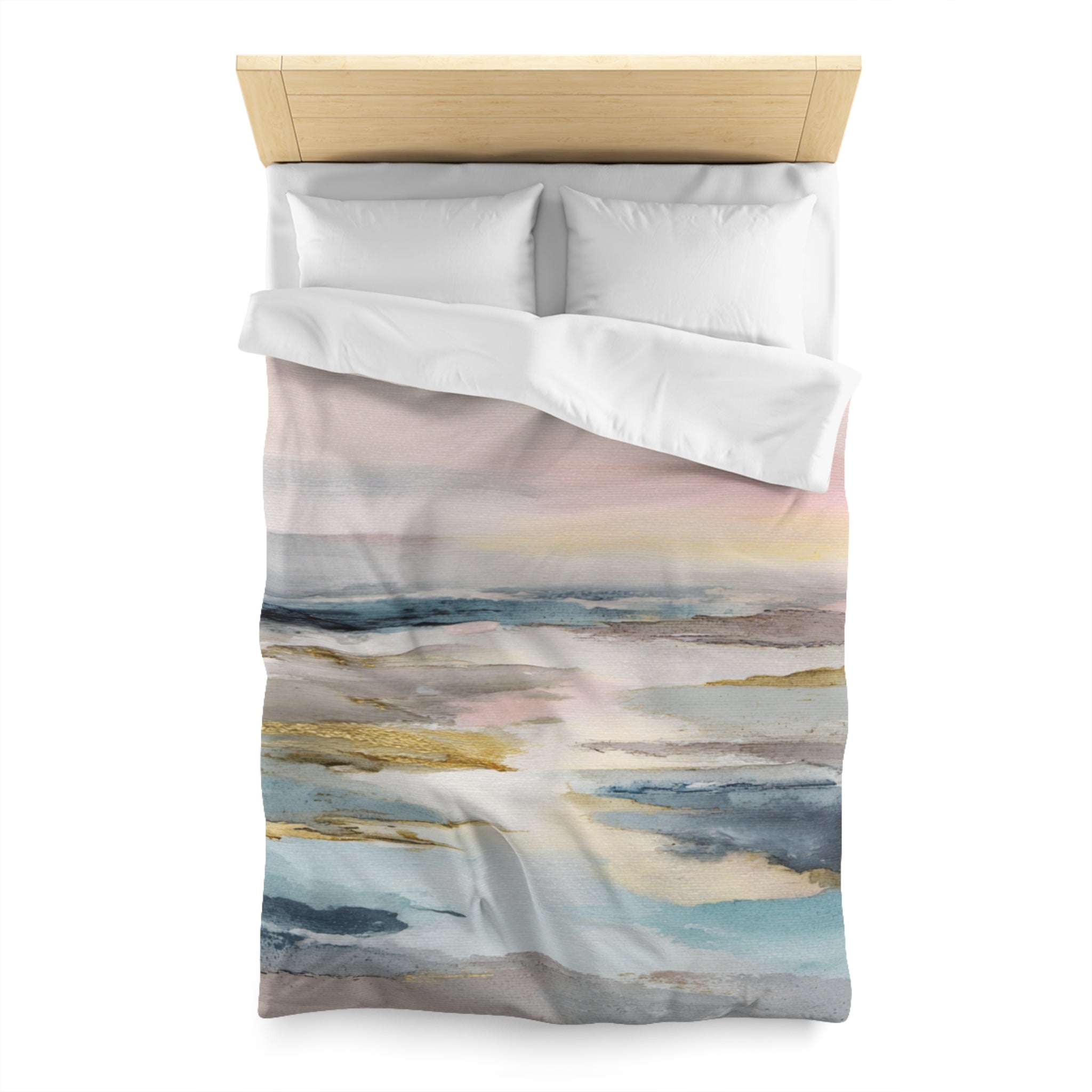 a bed with a colorful, abstract watercolor-style comforter and pillows.
