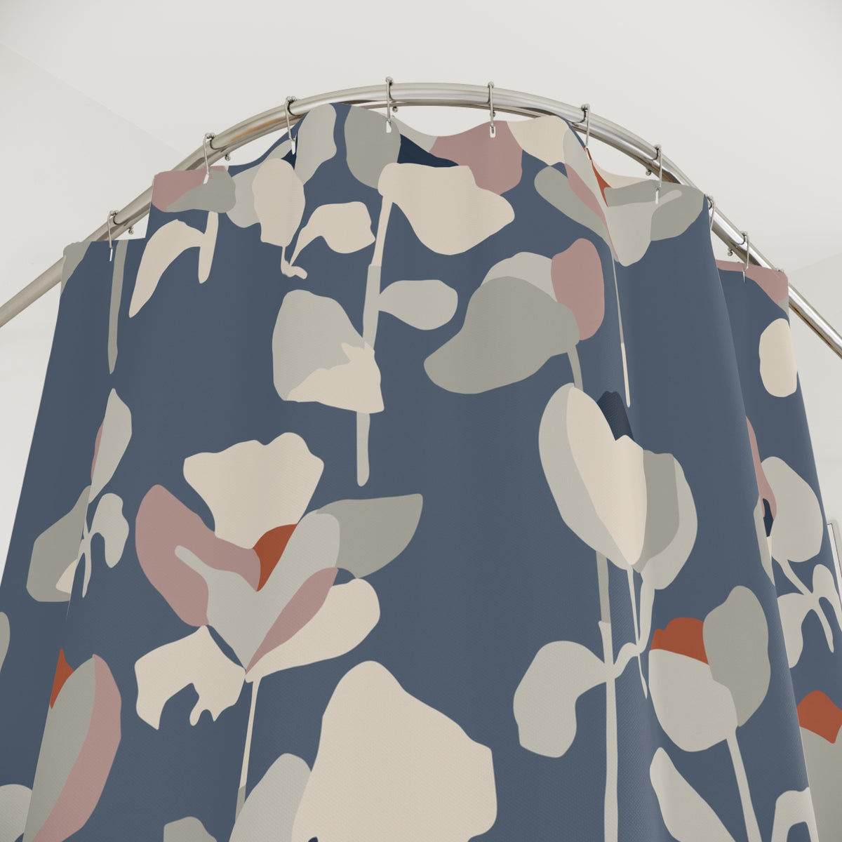 a shower curtain with a floral pattern in shades of blue, pink, and white.