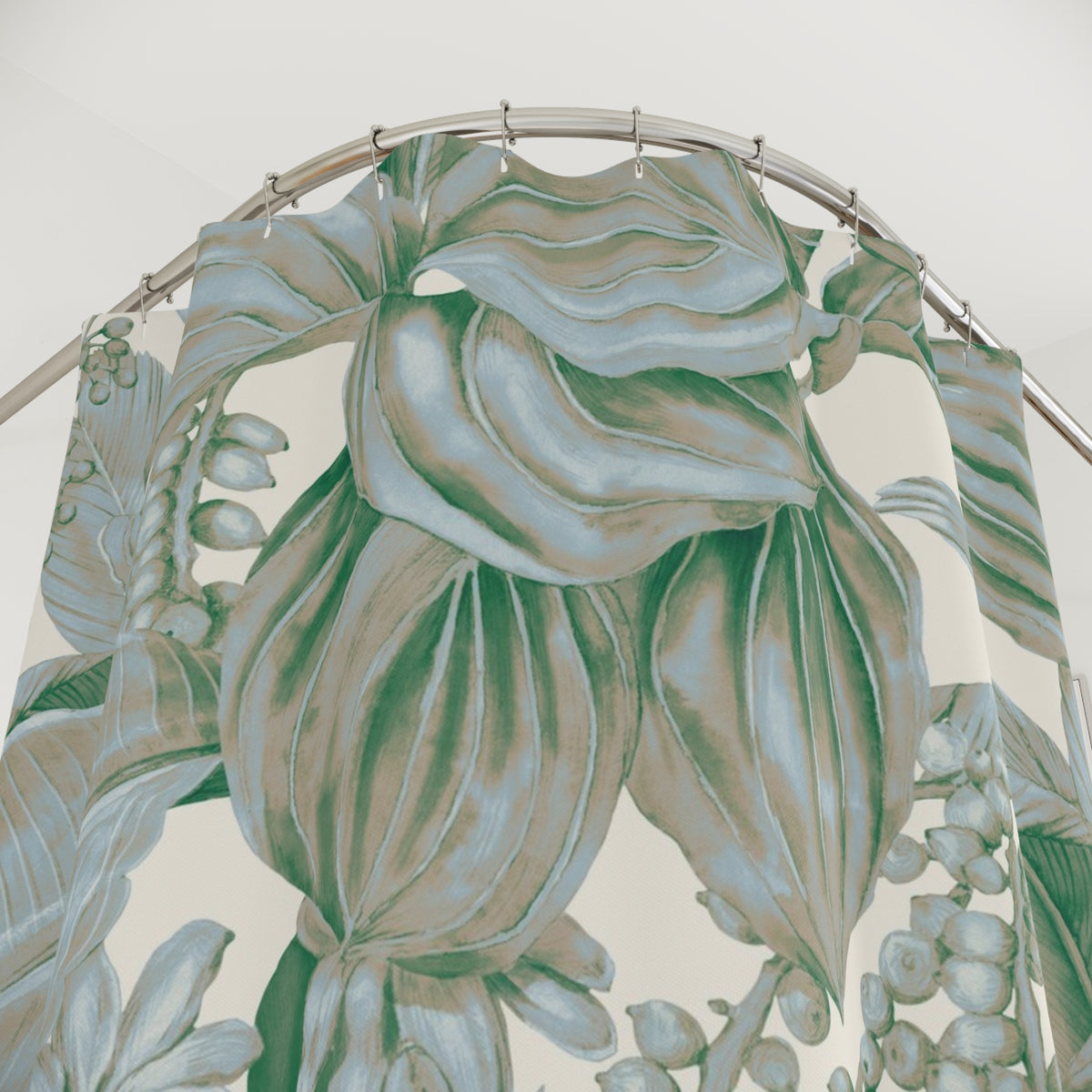 a shower curtain with a large, detailed print of green and beige tropical leaves and flowers.
