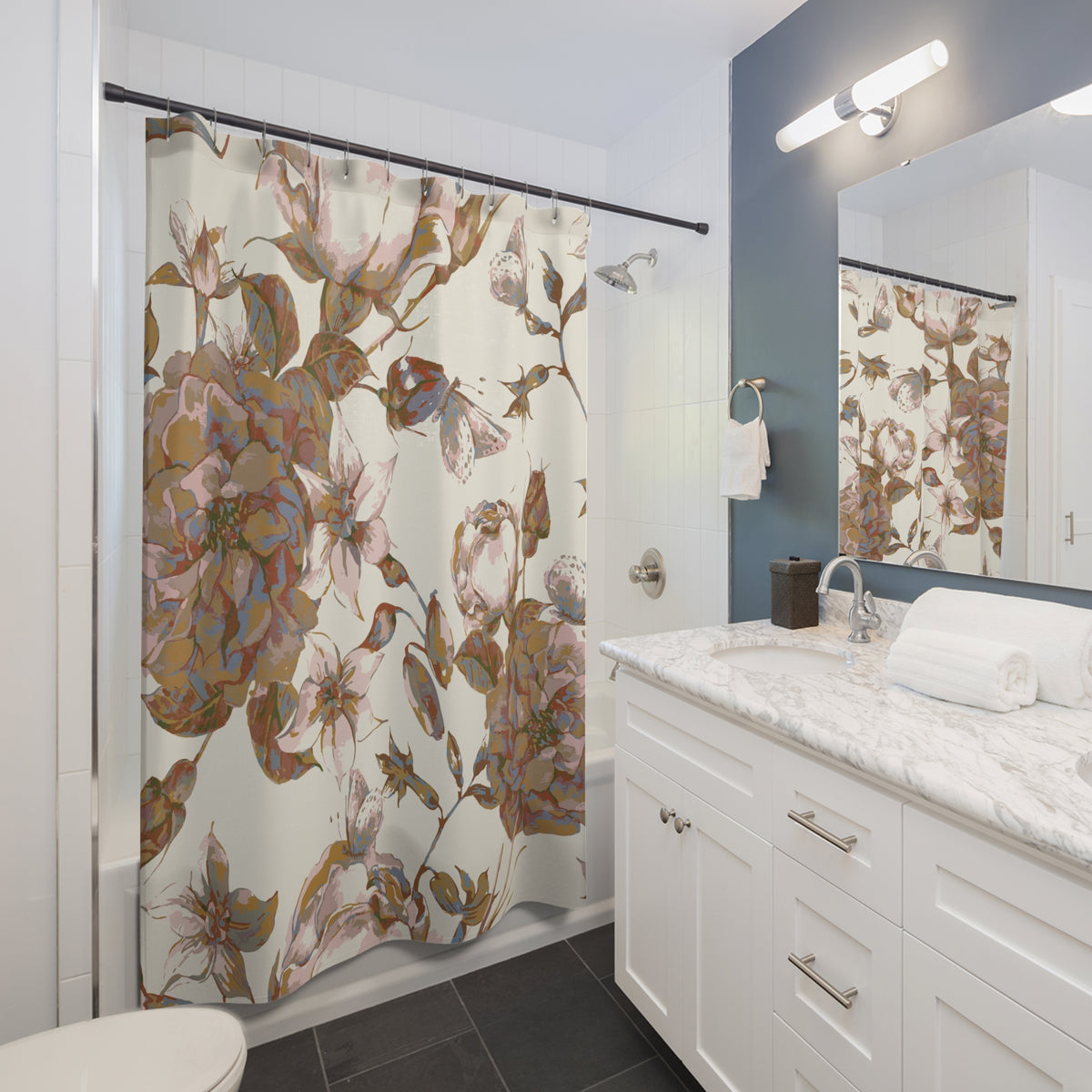 a bathroom with a floral patterned shower curtain, a white vanity with a marble countertop, and a mirror above the vanity.