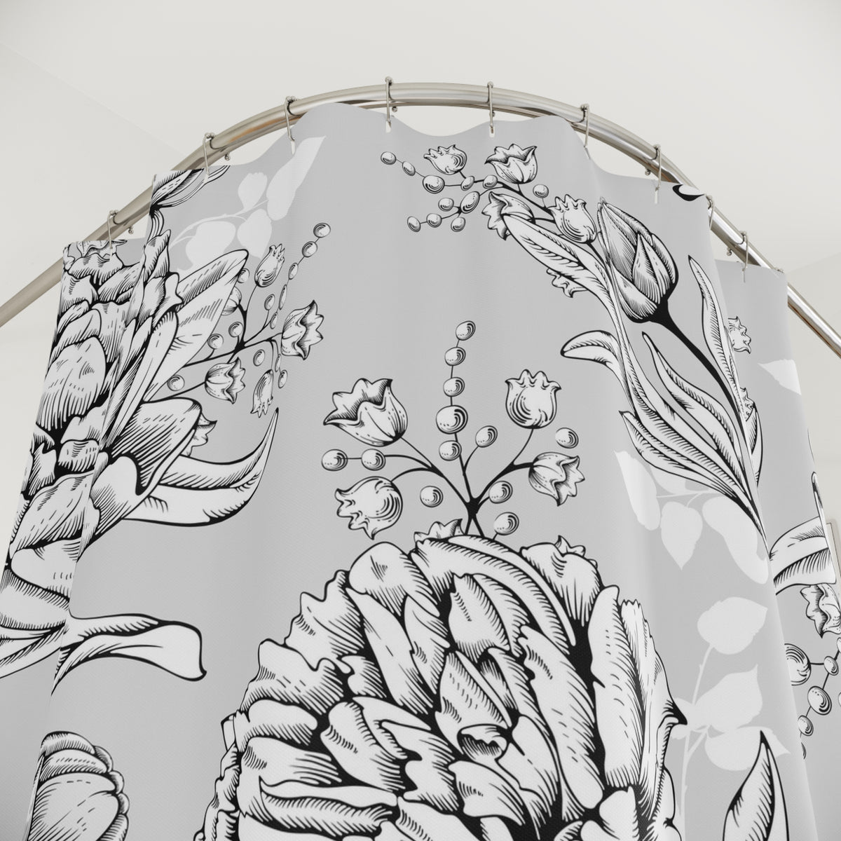 a shower curtain with a floral pattern, including various flowers and leaves.