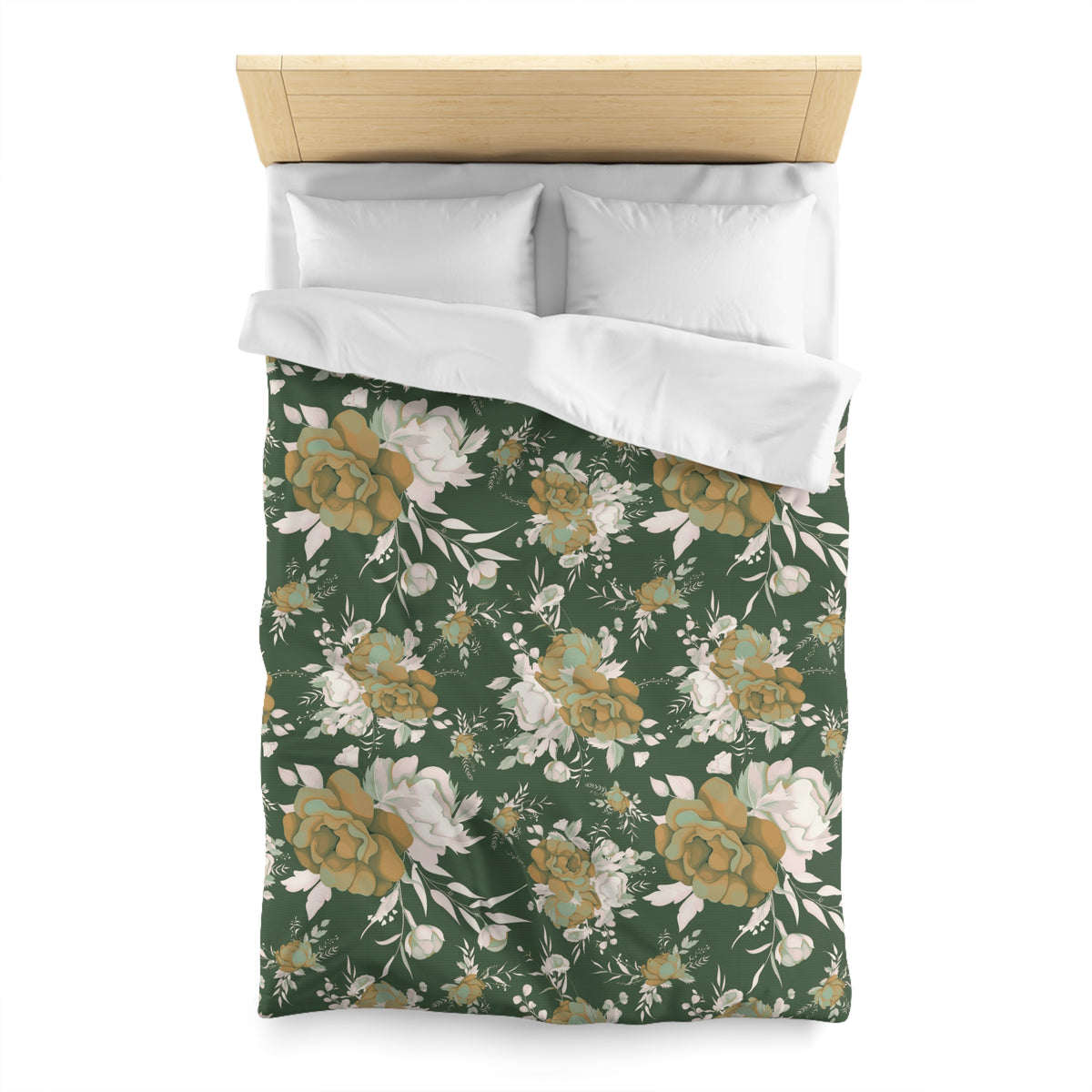 a bed with a floral print duvet cover and pillows.