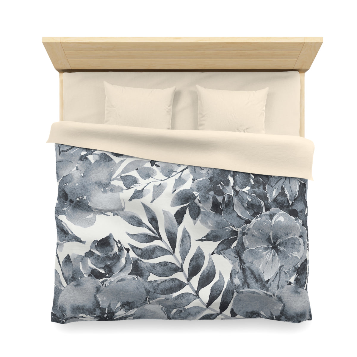 a neatly made bed with a floral print duvet cover and two pillows.