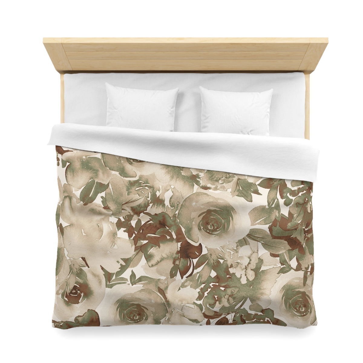 a bed with a floral print duvet cover and two white pillows.