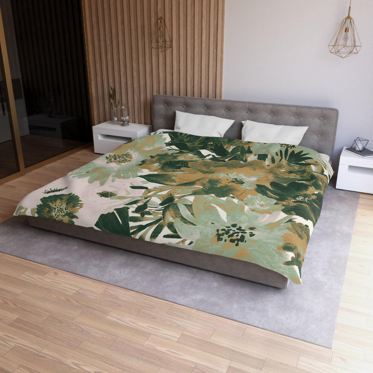 a modern bedroom with a large bed covered in a green and white floral print comforter. The bed is positioned against a wall with a wooden panel. The room also features a nightstand, a pendant light, and a mirror.