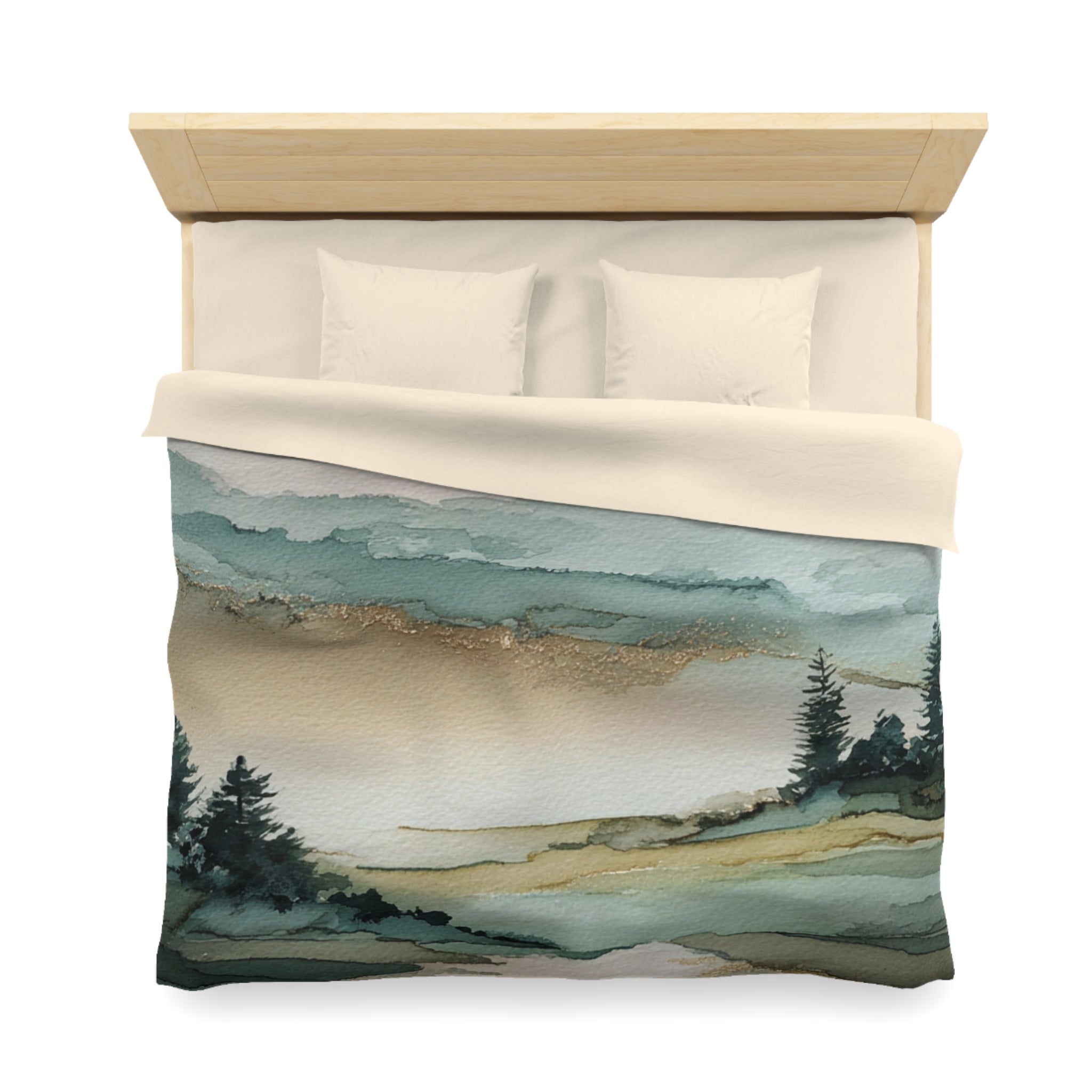 a bed with a quilt featuring a landscape scene with trees and a body of water.