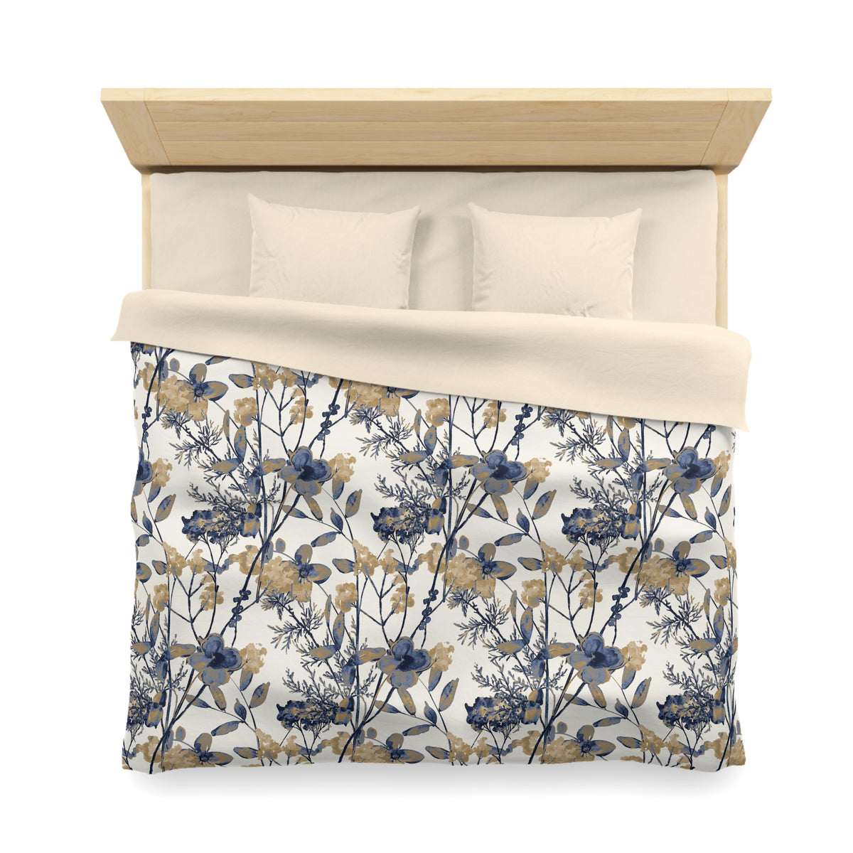 a neatly made bed with a floral print comforter and pillows.