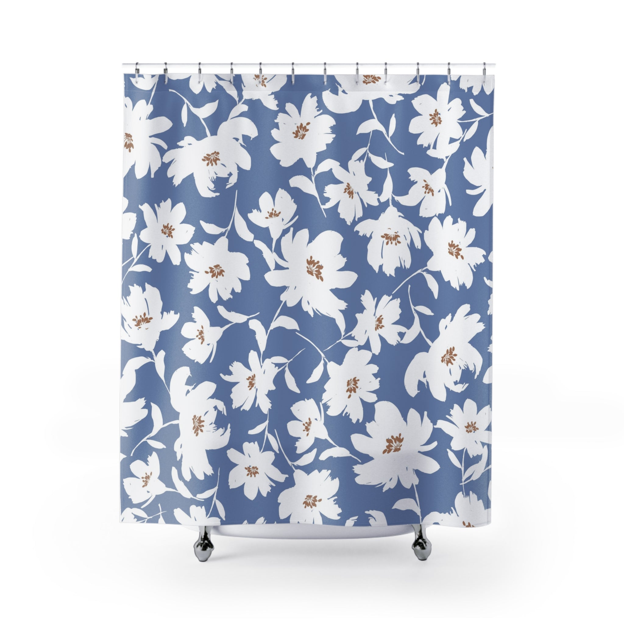 a blue shower curtain with a white floral pattern.