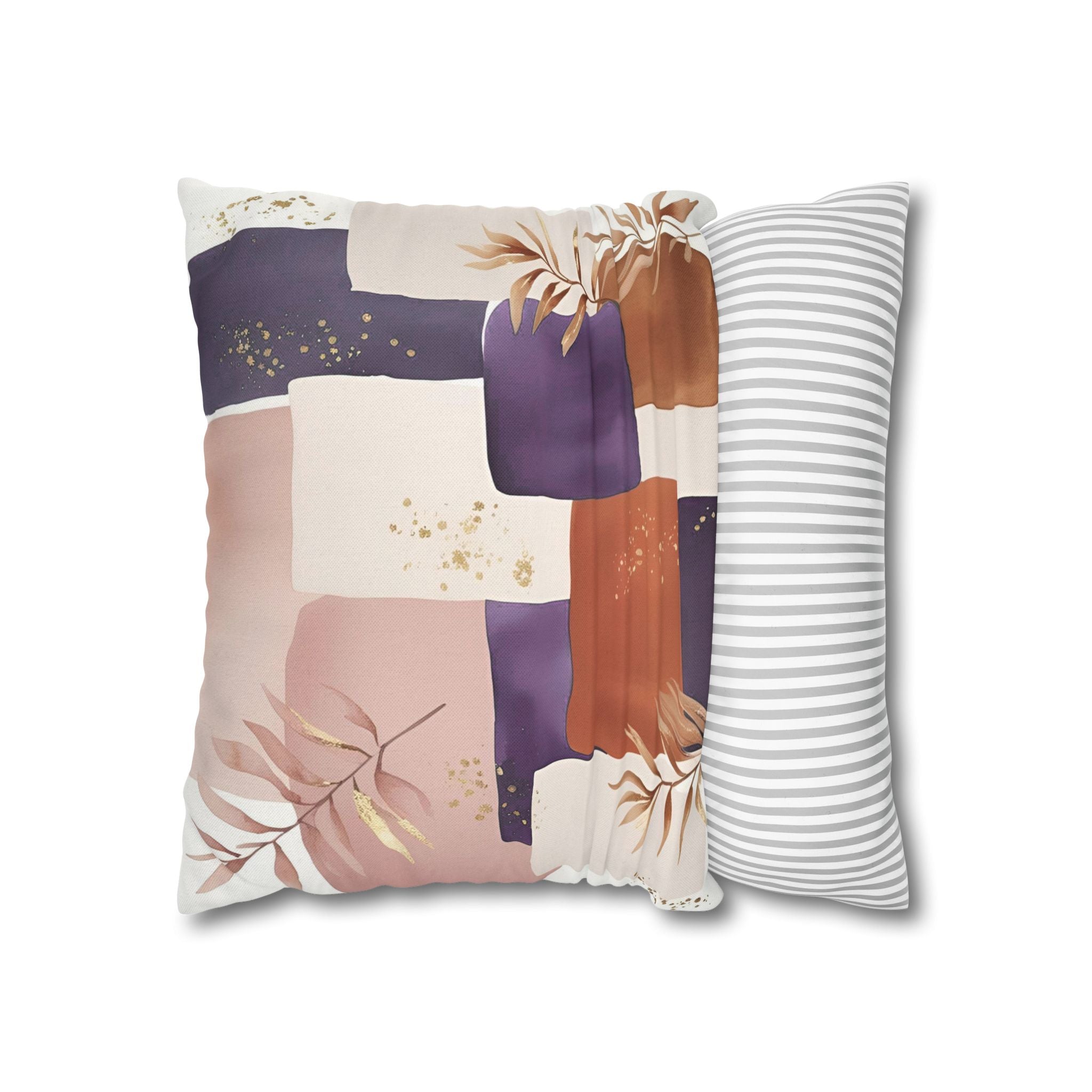 a square pillow with a colorful abstract design, including shades of purple, pink, and orange, along with some gold glitter accents.