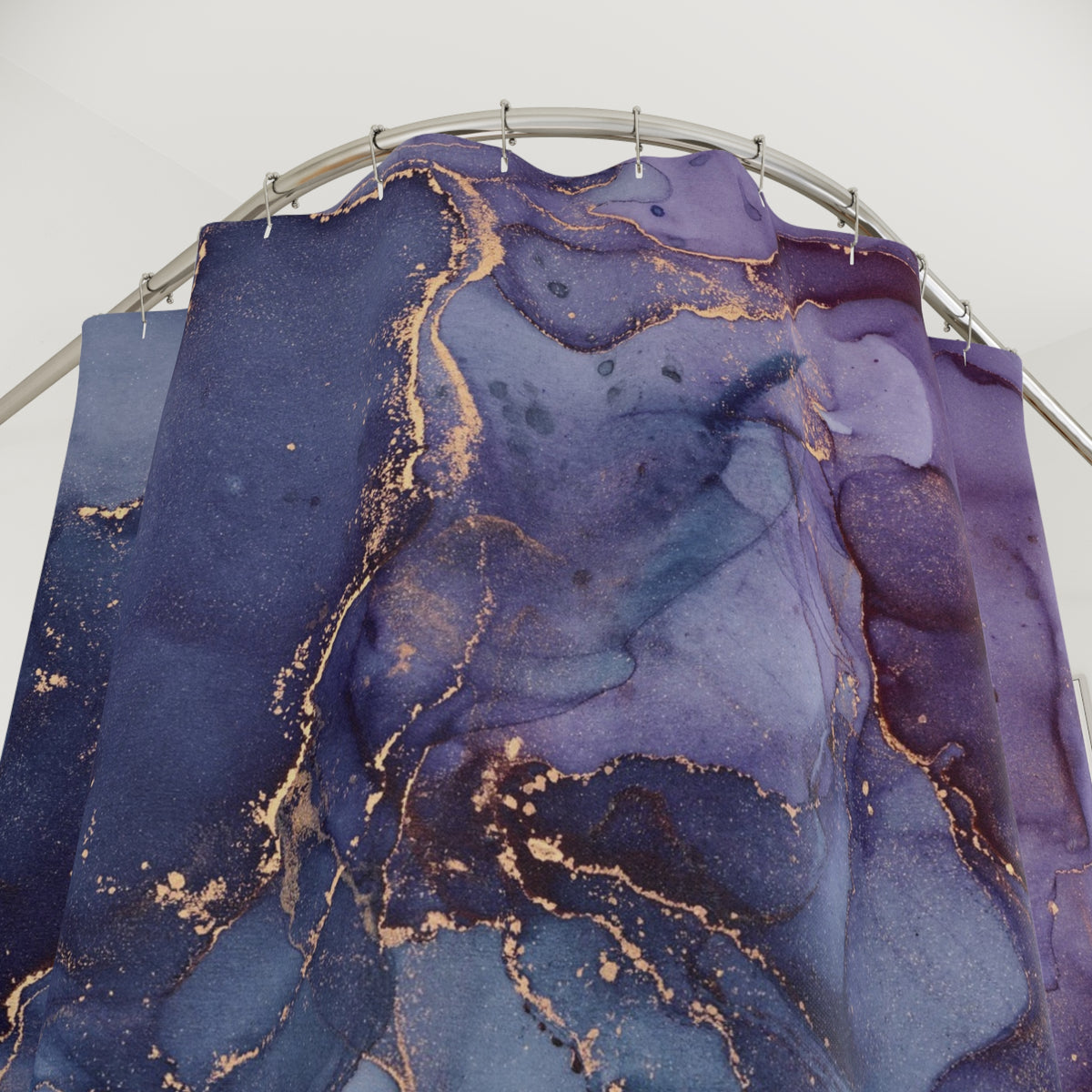 a large, abstract, and colorful abstract painting with a mix of blue, purple, and gold colors. The painting appears to be a large canvas or artwork, hanging from a metal frame.