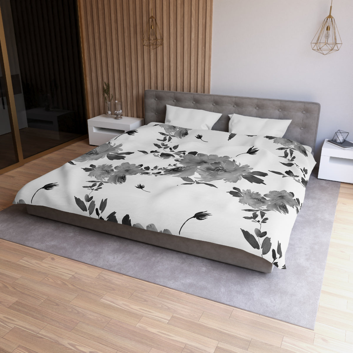 a modern bedroom with a large bed featuring a floral print comforter and pillows. The bed is positioned against a wall with a wooden panel design. The room also includes a nightstand and a pendant light fixture, creating a cozy and stylish atmosphere.