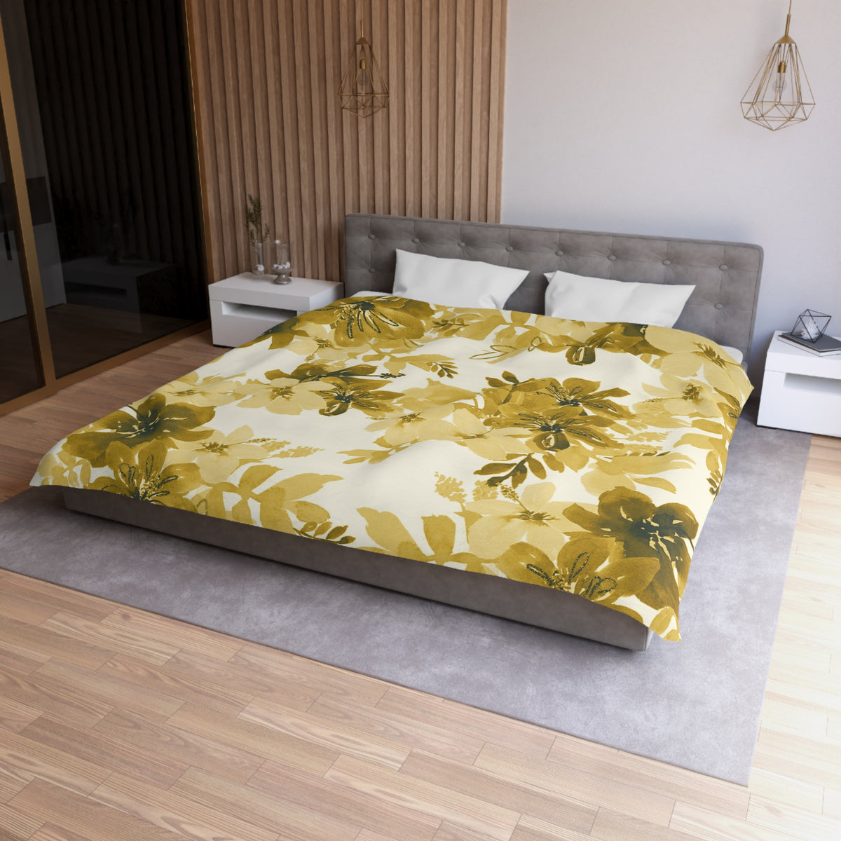 a modern bedroom with a large bed covered in a yellow and green floral comforter. The bed is positioned against a wall with a wooden panel. The room also features a nightstand, a pendant light, and a mirror.