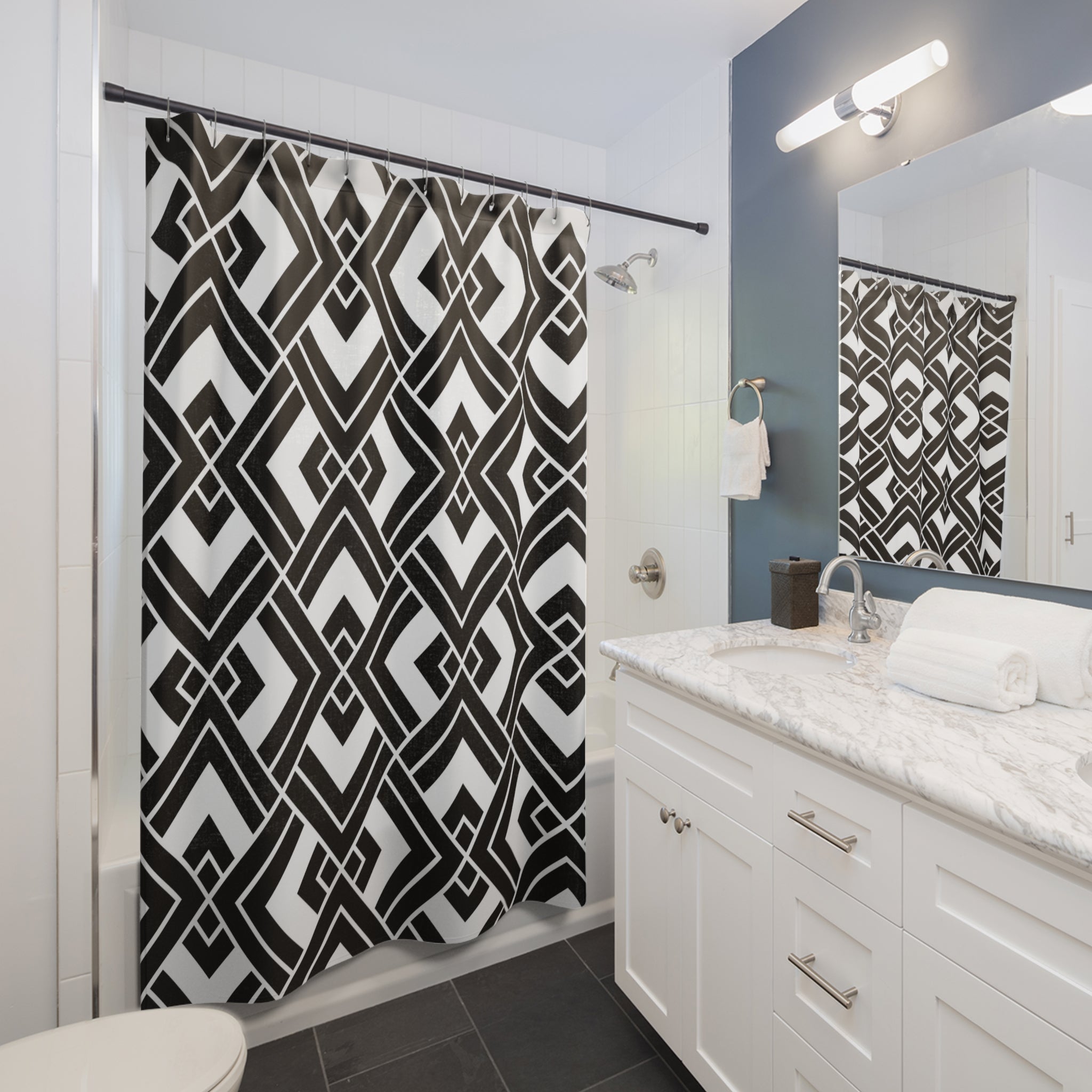 a bathroom with a black and white shower curtain