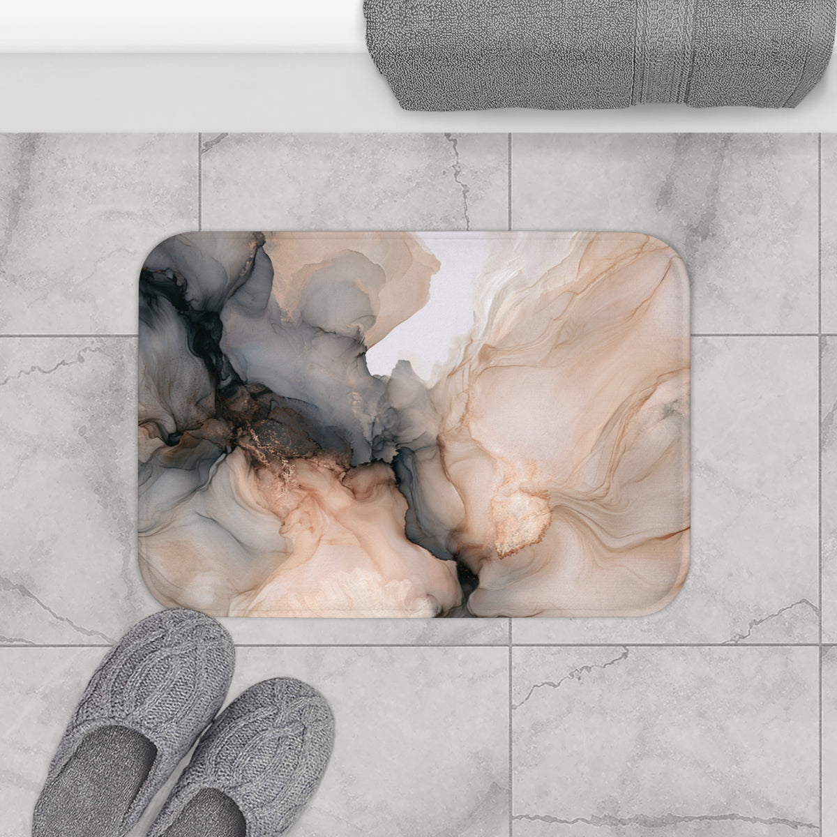a bathroom scene with a marble-like floor, a pair of gray slippers, and a decorative bath mat with an abstract floral pattern.